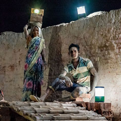 Workers in India using solar power
