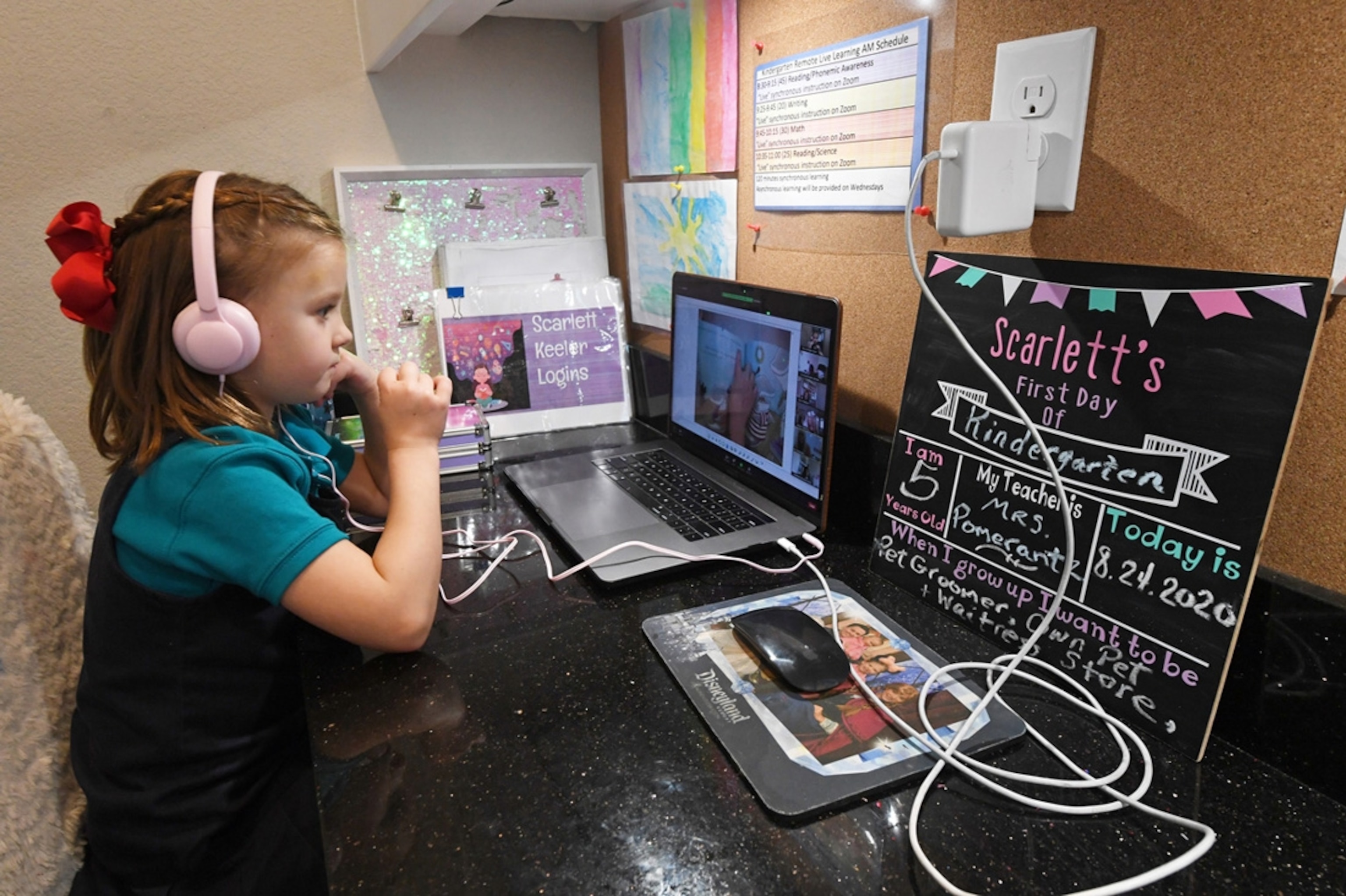 Scarlett Keeler, 5, takes an online reading and science class on her first day of distance learning.