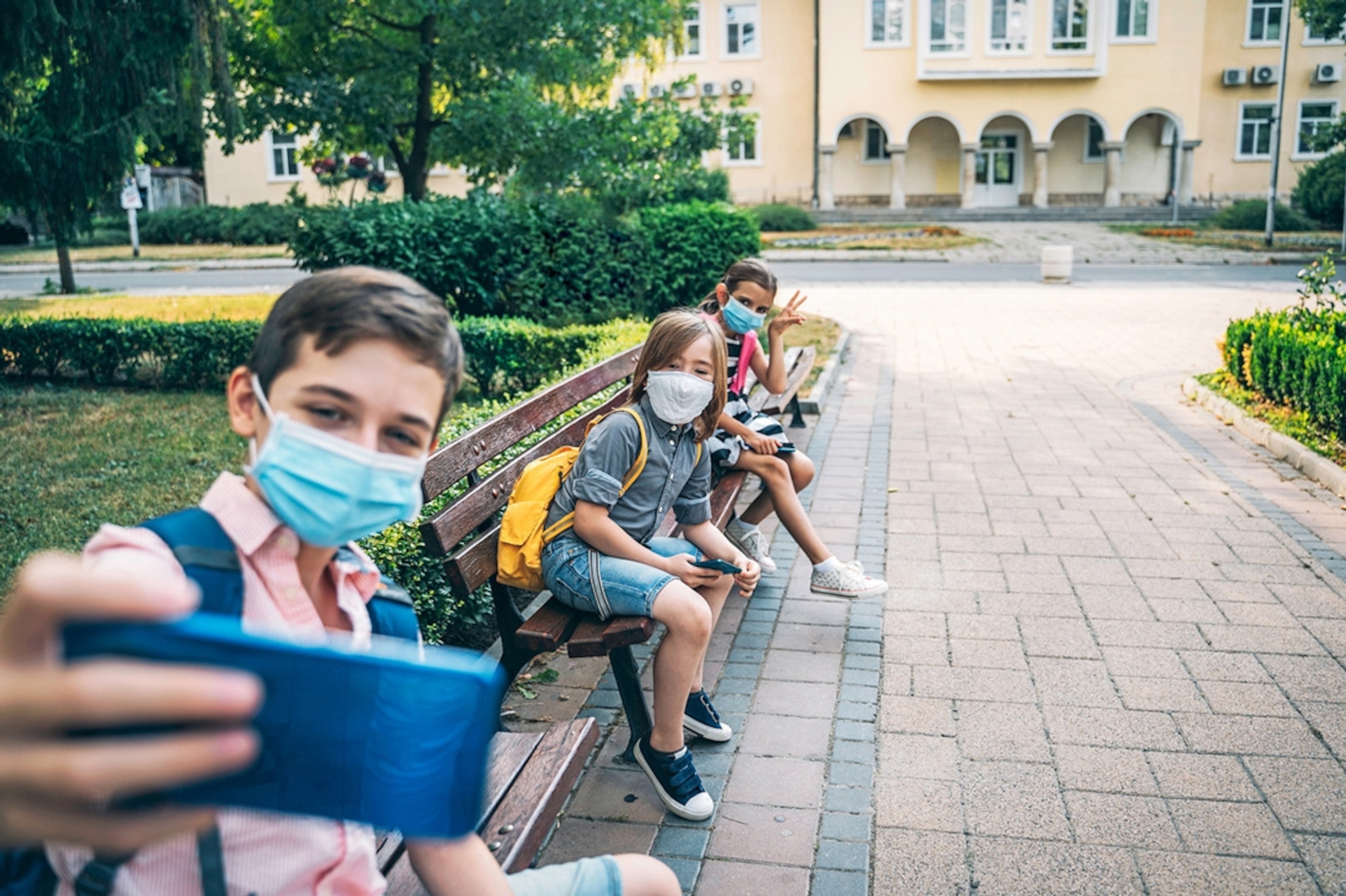 Back to school during quarantine, children making a selfie.
