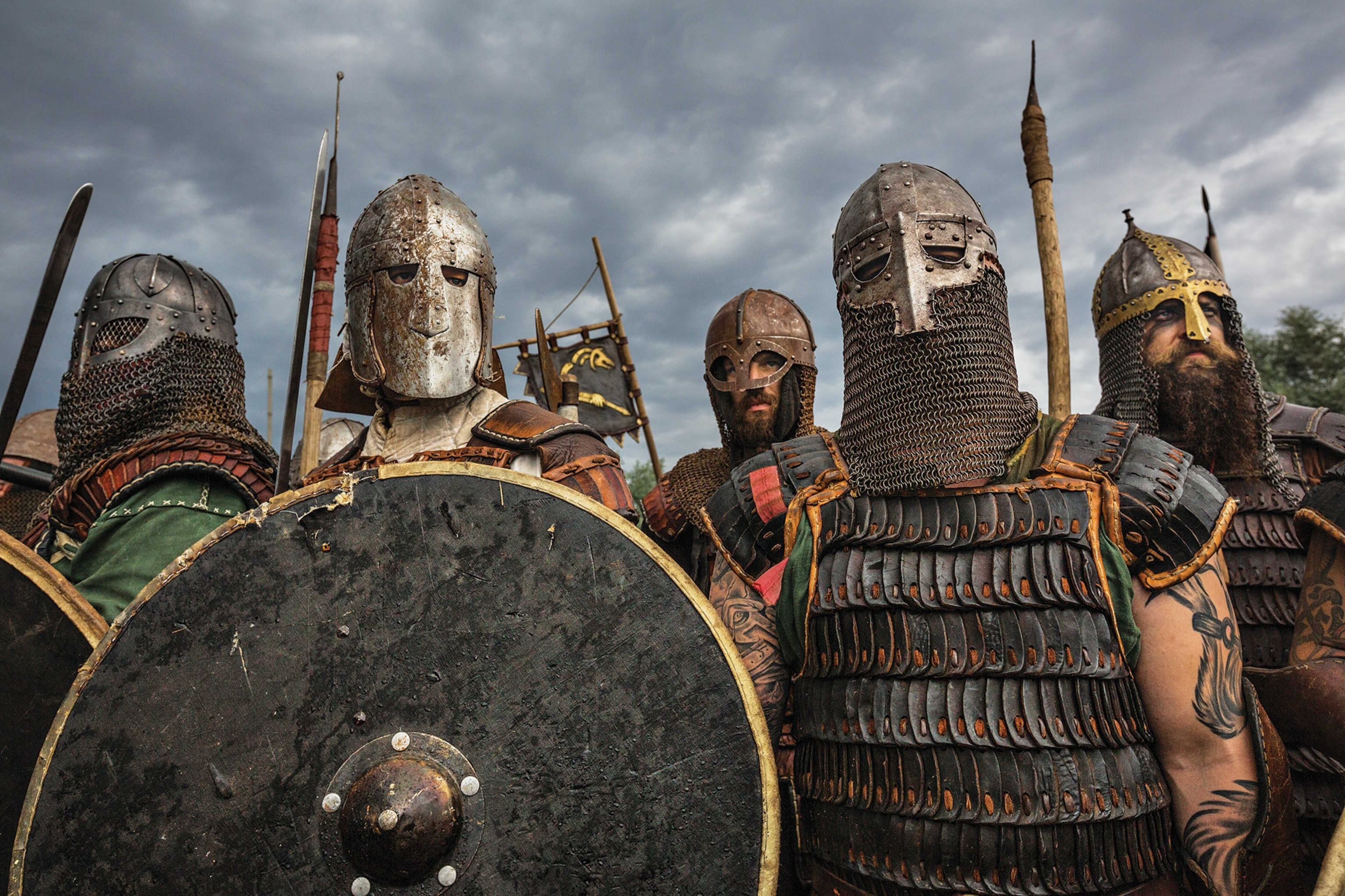 Sheathed in iron and leather, Viking reenactors wear their grim game faces.