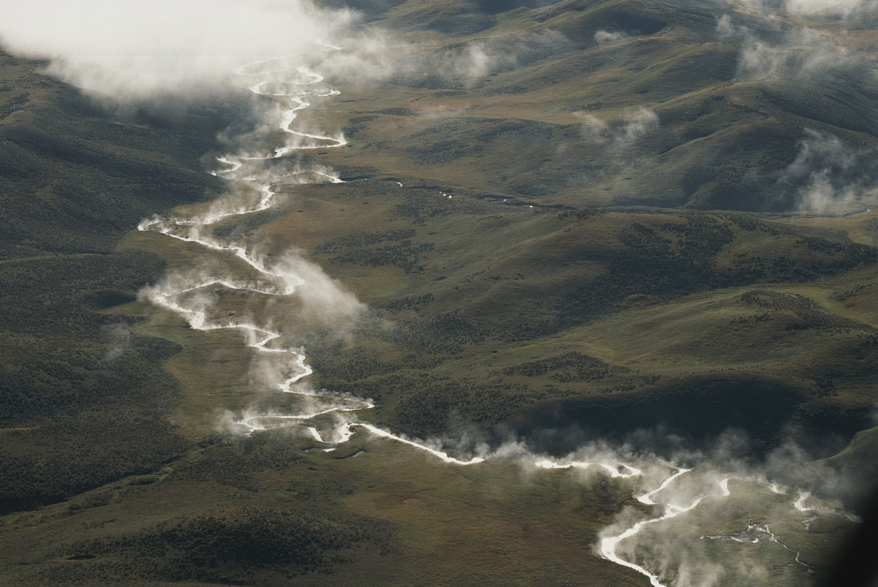 Aerial of mist rising from Alum Creek in Hayden Valley