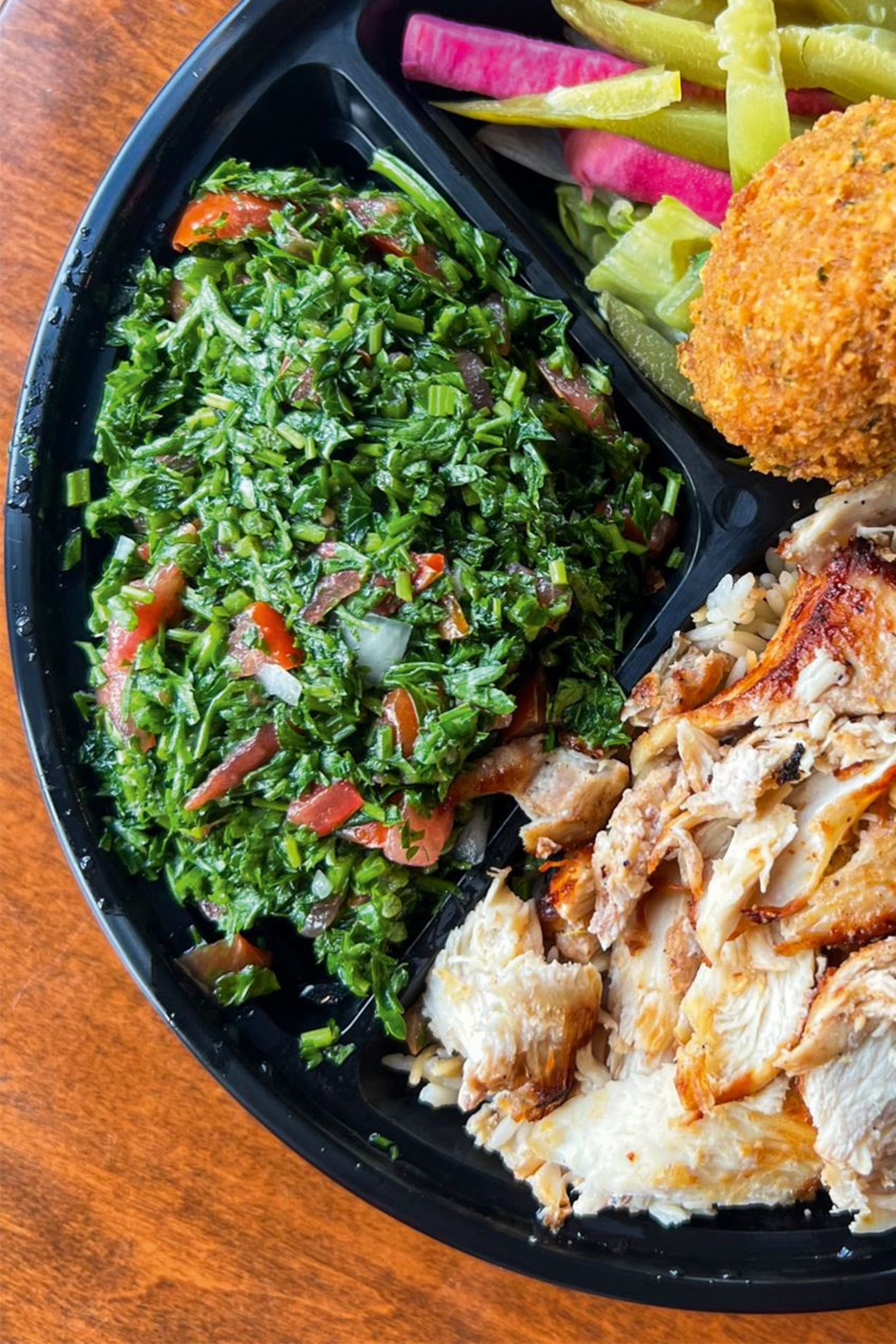 Middle eastern platter with shawarma and tabouleh