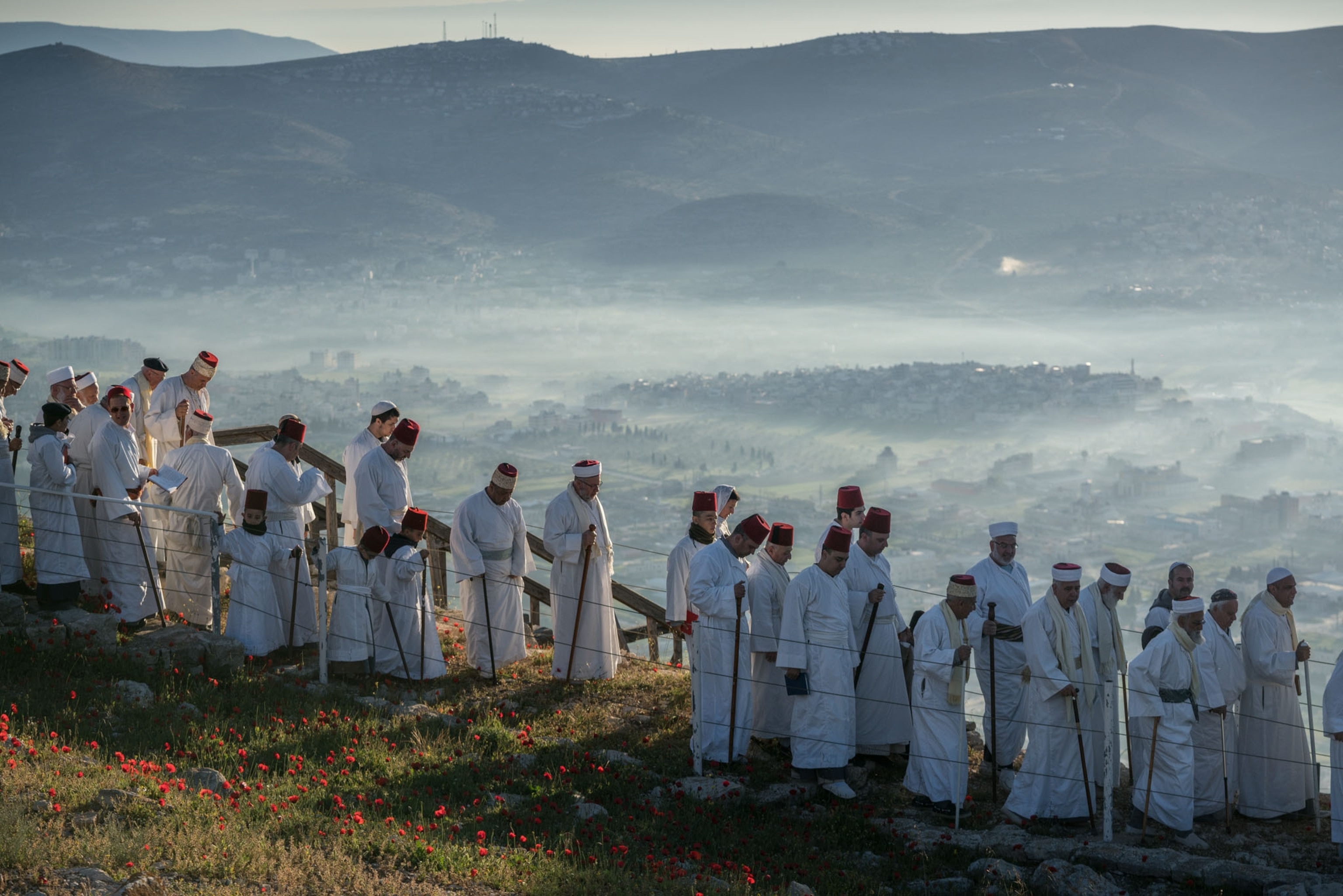 Samaritan men walking to the top of Mount Gerizim during Passover.