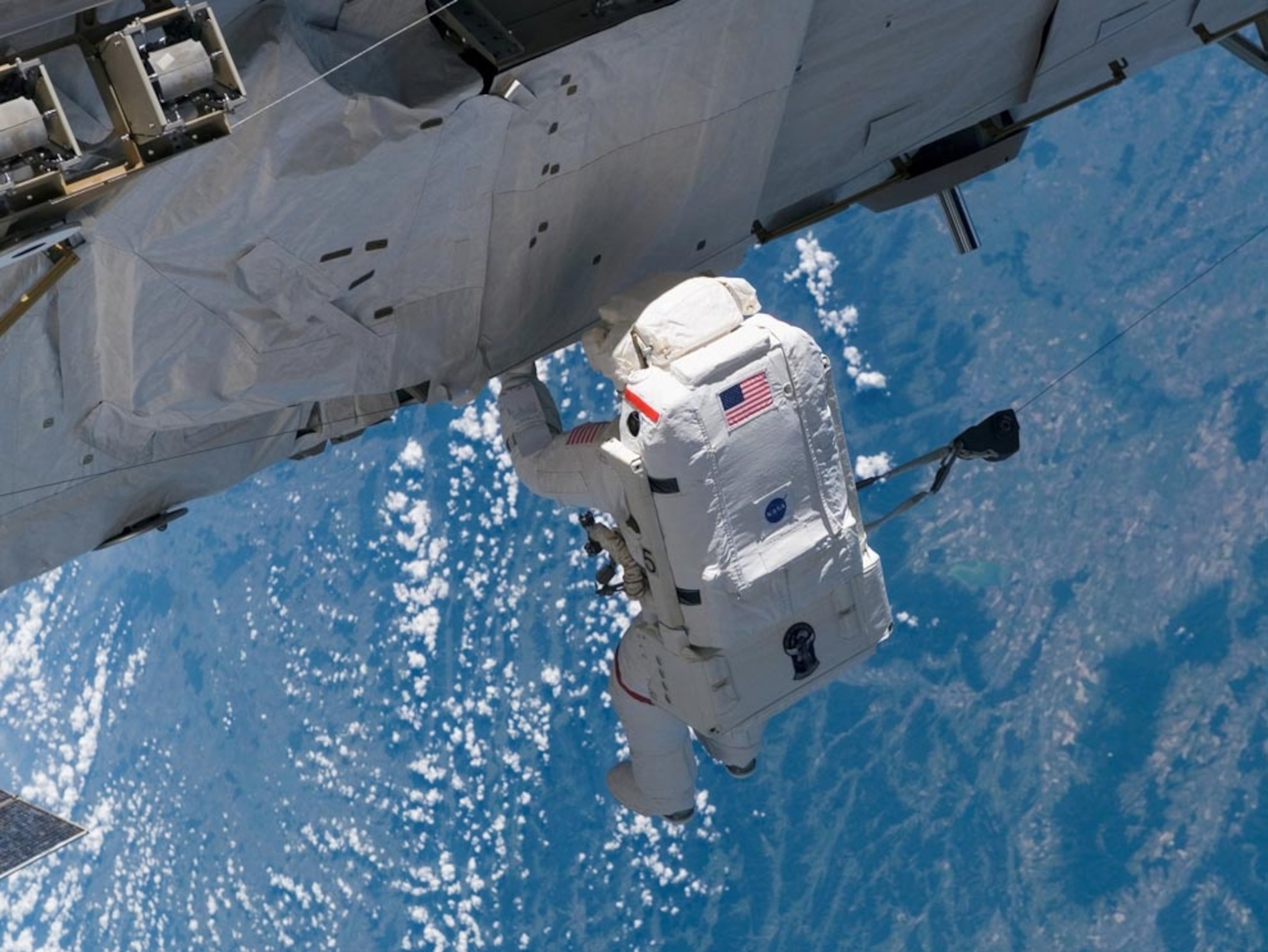 astronauts working on International Space Station