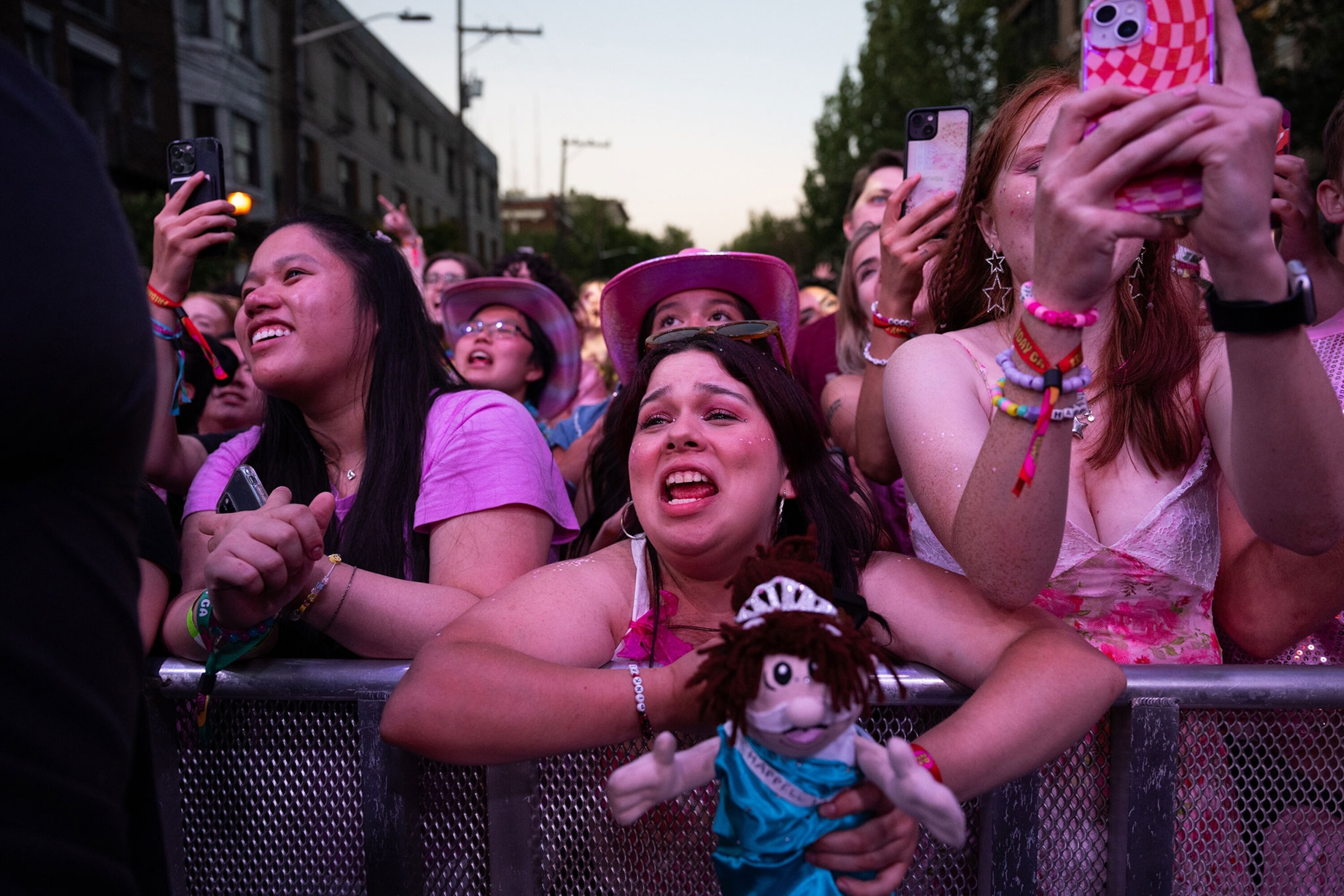 Girls screaming at a concert venue.