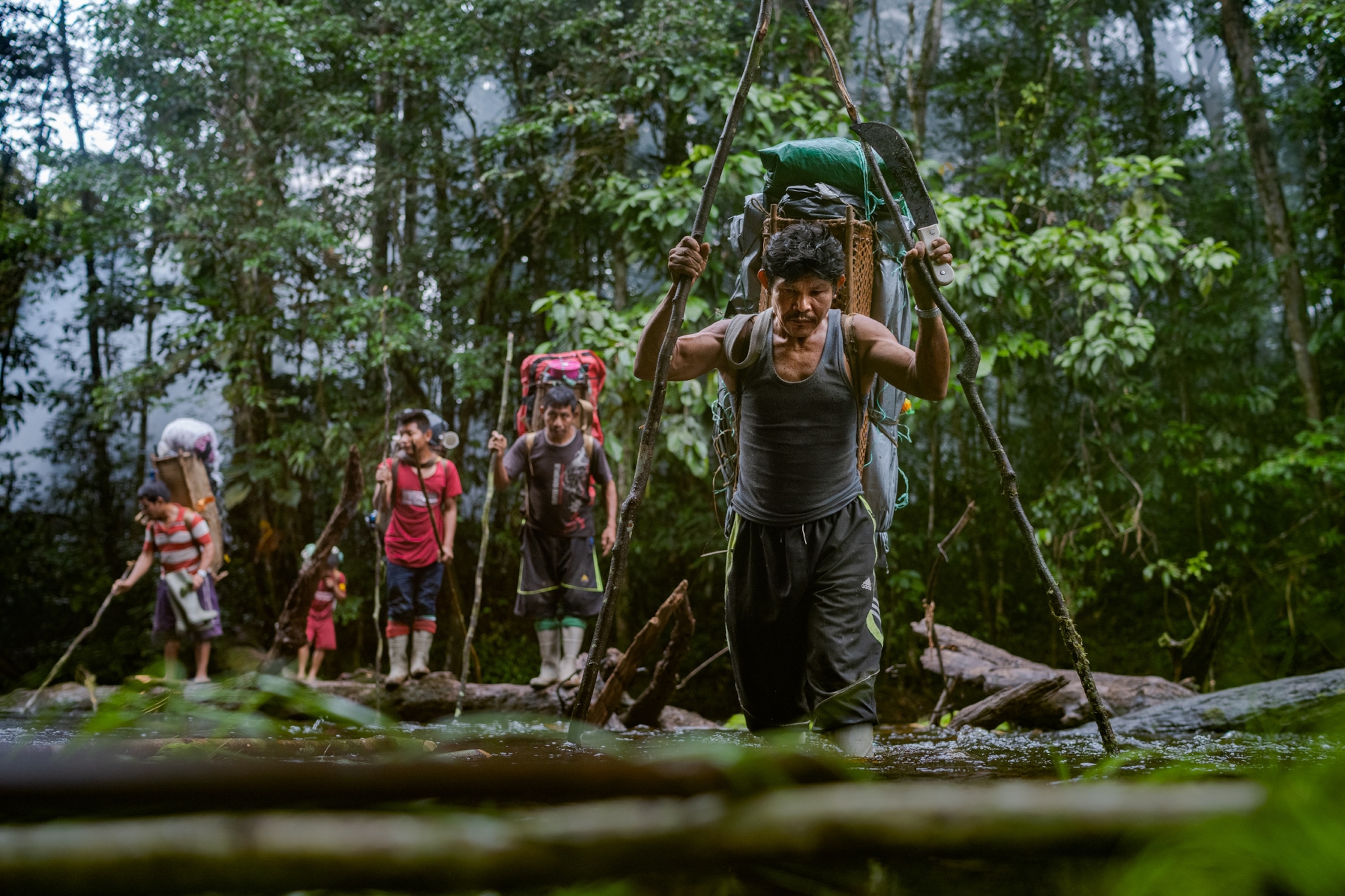Picture of group of porters crossing water.