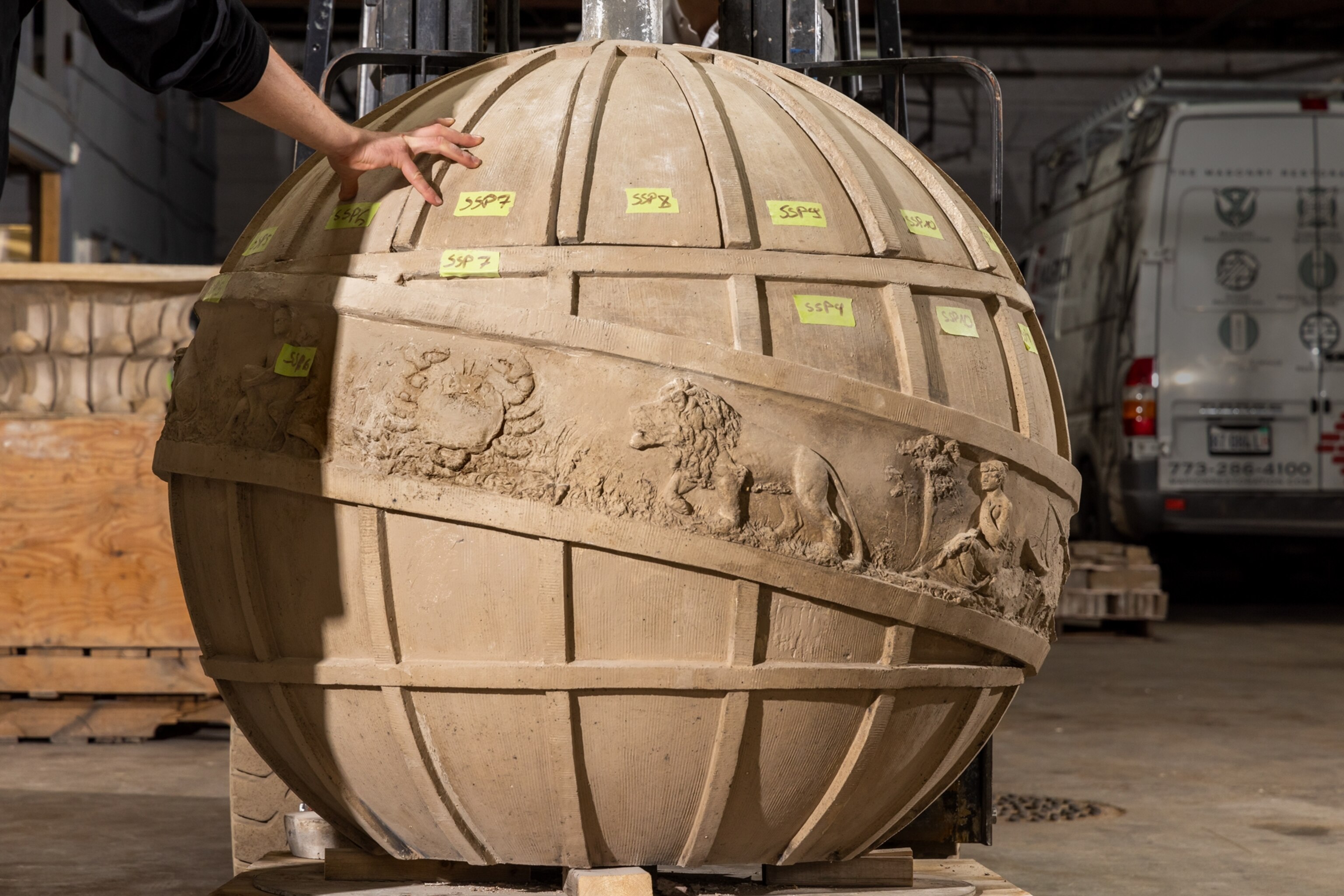 A large globes with zodiac symbols along Celestial equator belt.