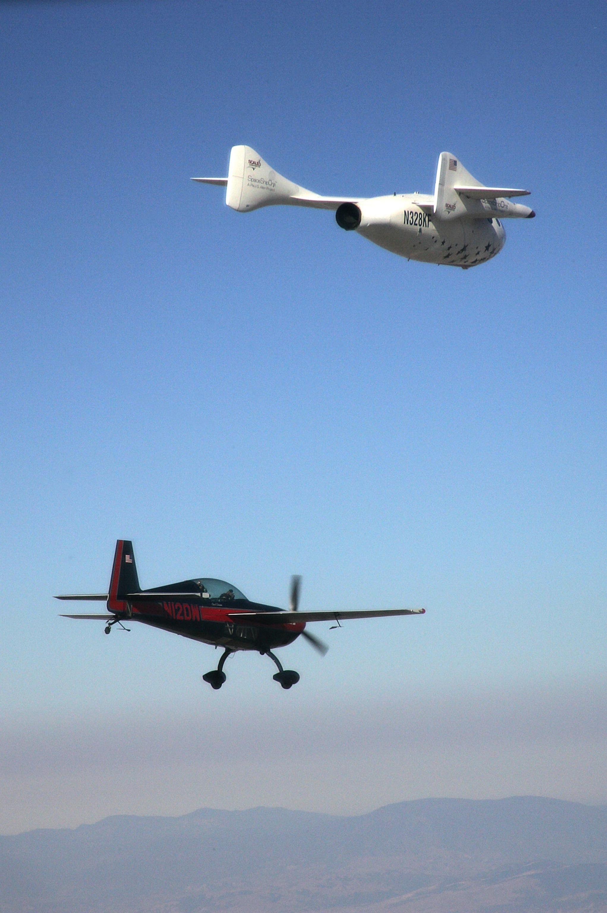 A chase plane follows SpaceShipOne after it completed its first flight beyond 100 kilometers.