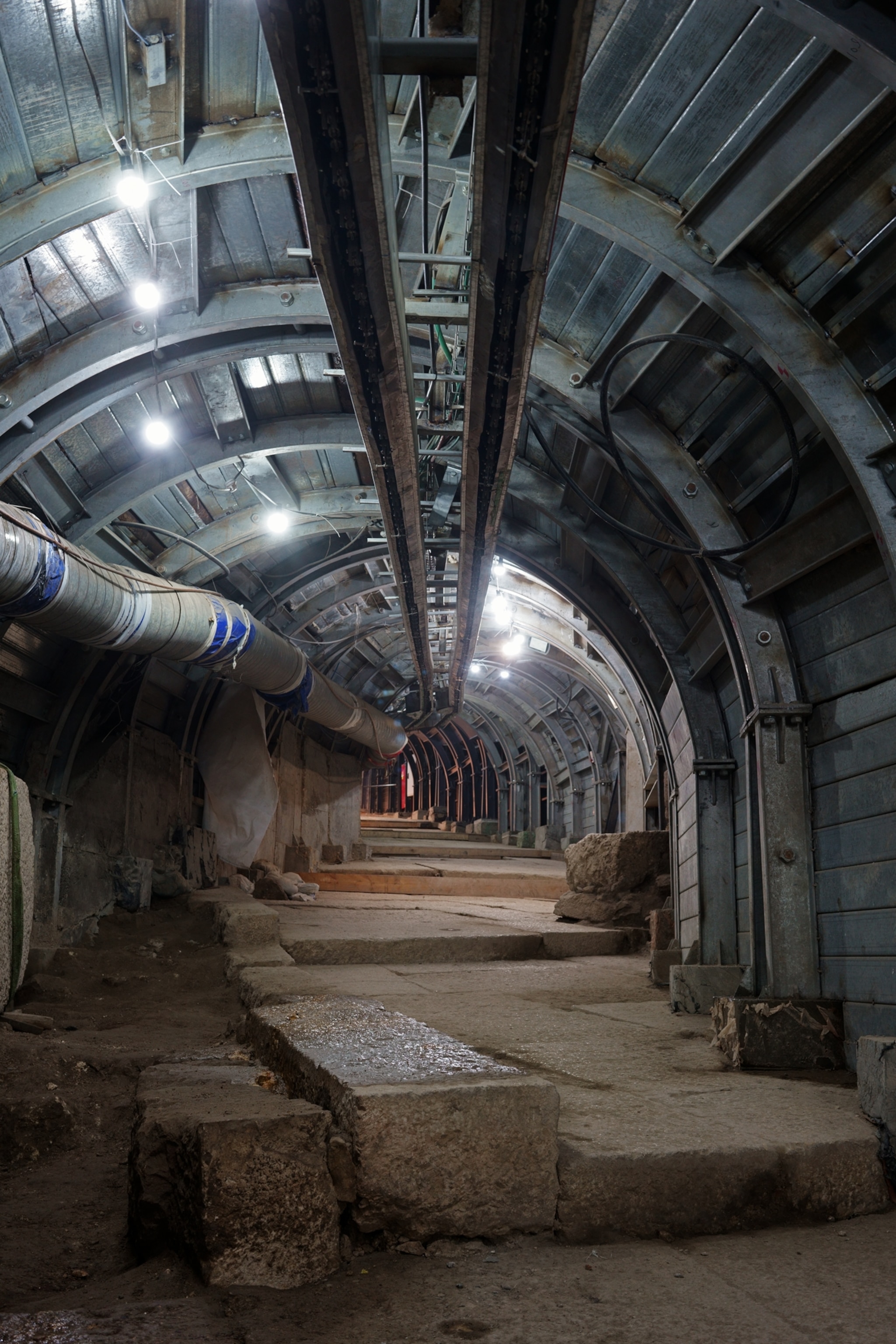 an underground tunnel lit with fluorescent light