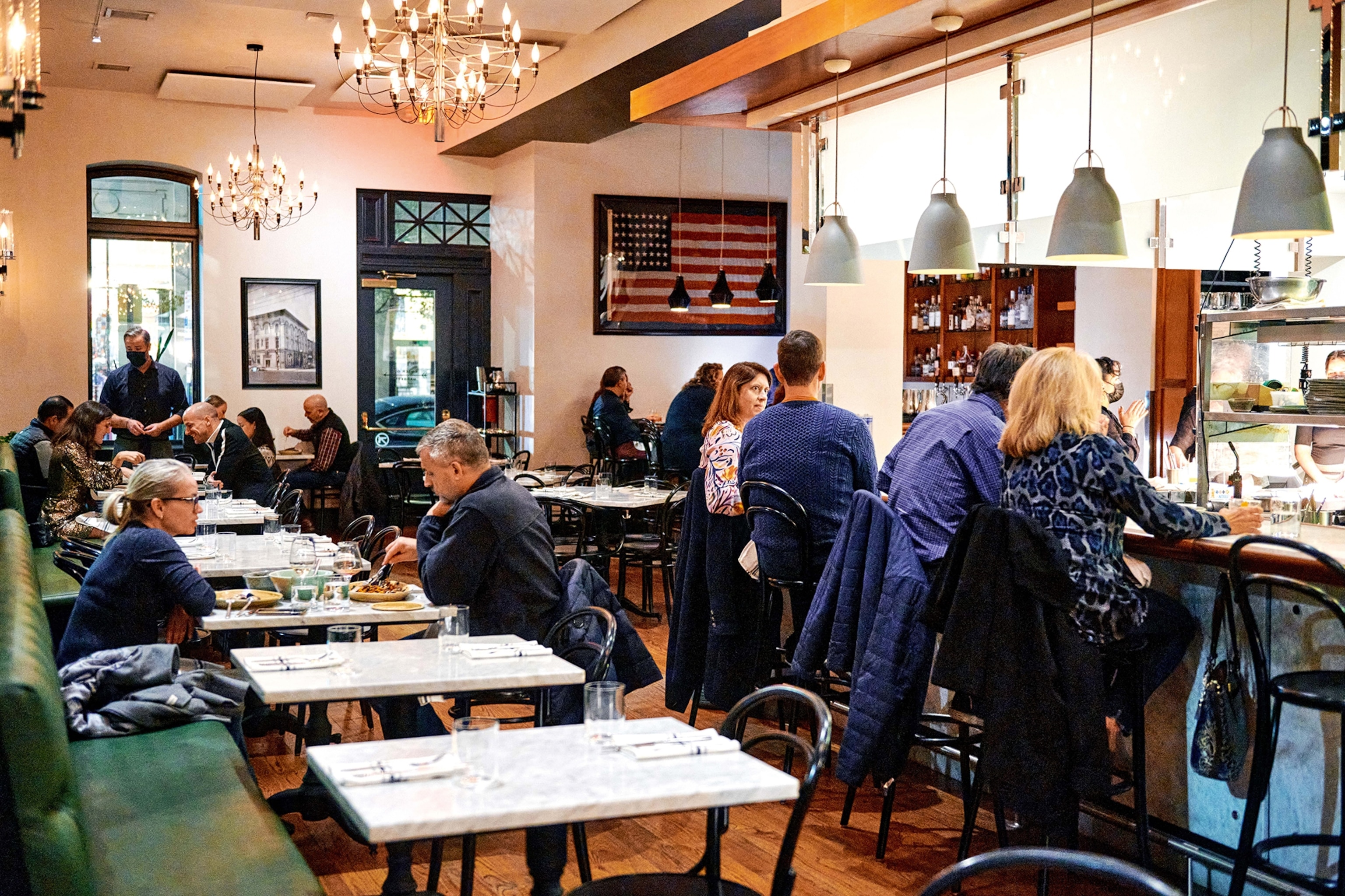 People eating in the dining room at Death & Taxes.