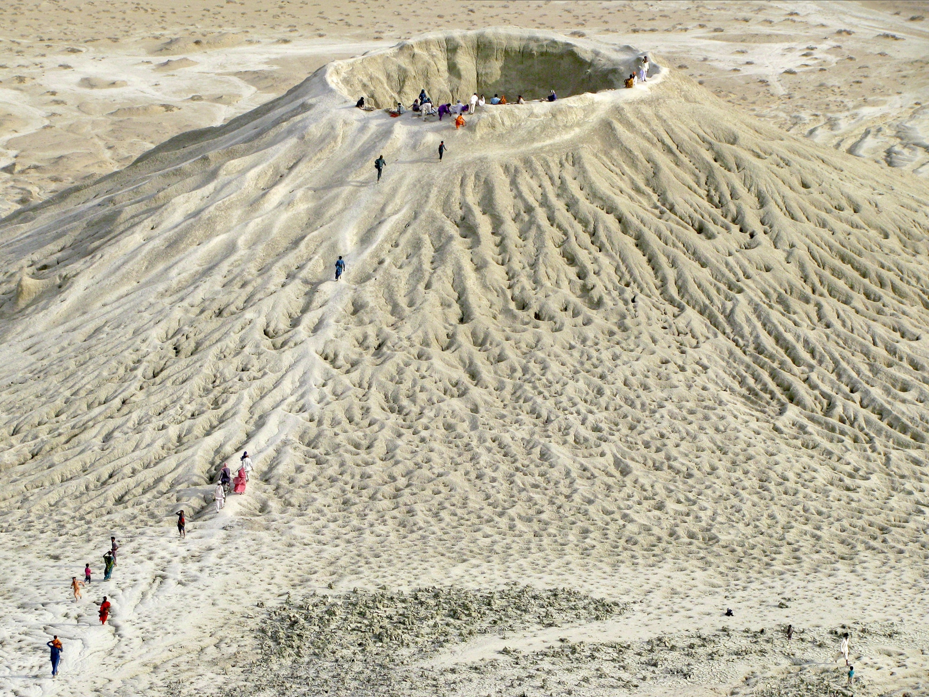 pilgrims at a mud volcano in Hingol National Park, Pakistan