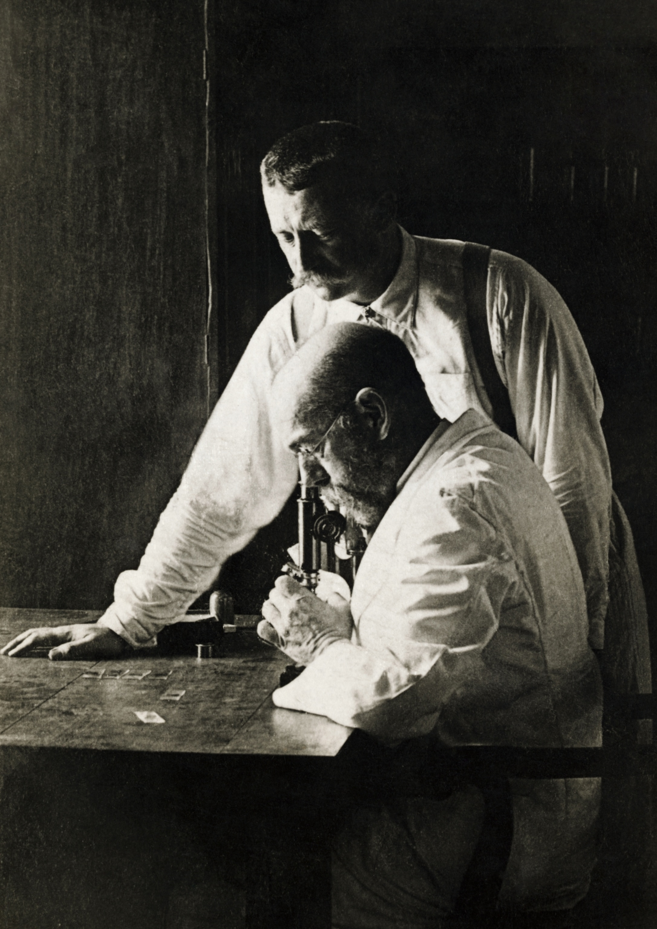 Robert Koch, 1843-1910, the founder of bacteriology and discoverer of the Cholera and tubercular bacillus, in his study with his oldest student and assistant, Professor Dr. Pfeiffer, who as director of the Institute for Hygiene at the University in Breslau.