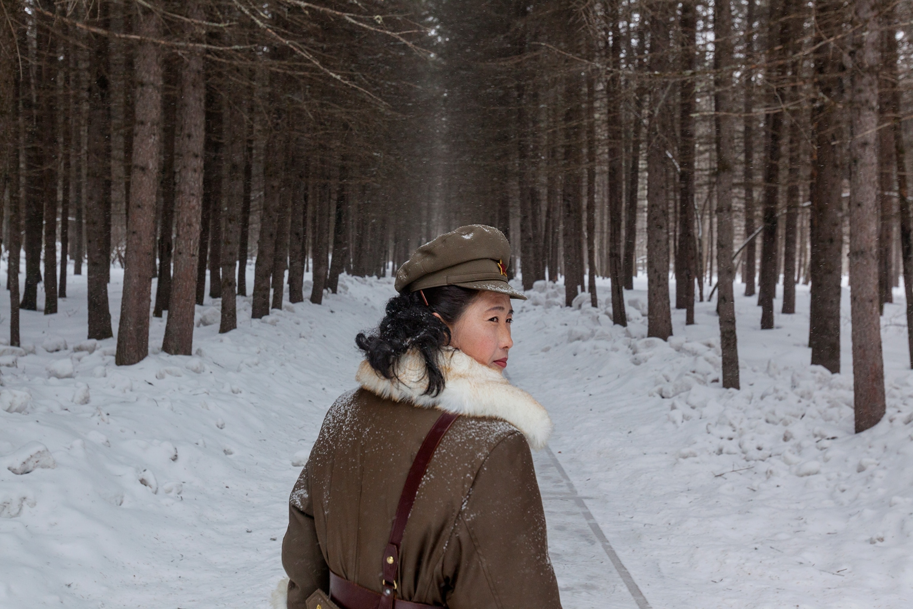 north korean woman soldier in snowy forest