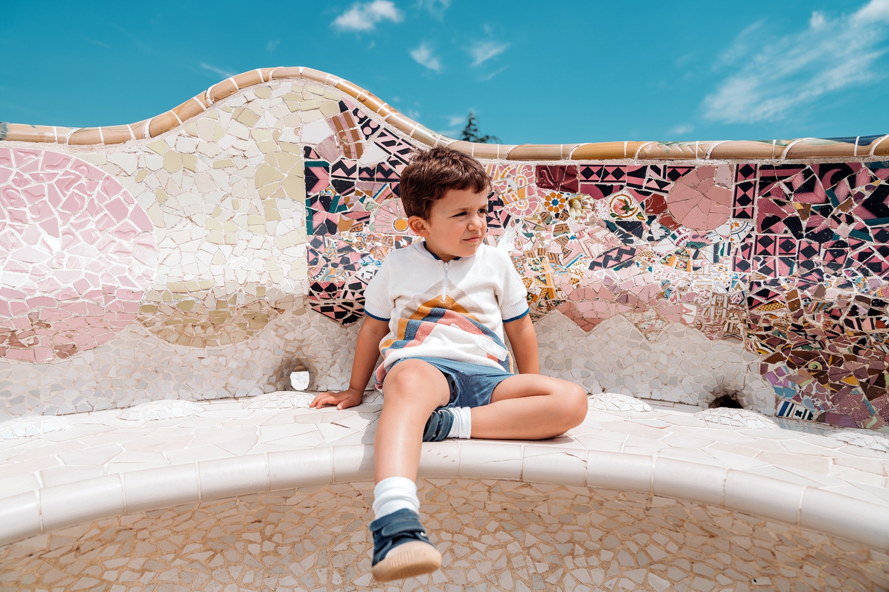 A boy sitting on a bench