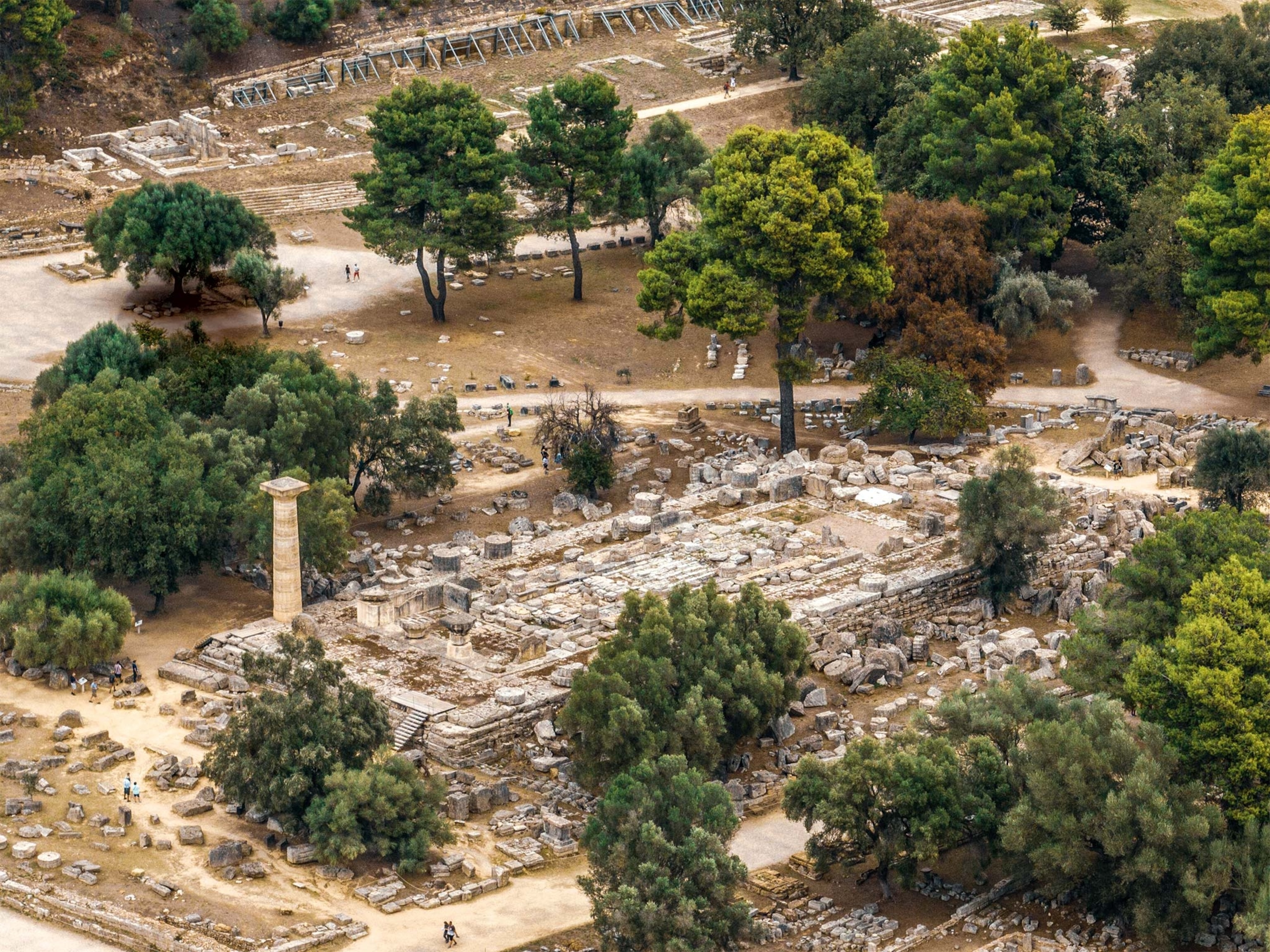 An aerial view of the ruins of the Temple of Zeus in the sanctuary of Olympia, with the anastylosis, or reconstruction, of one of its columns
