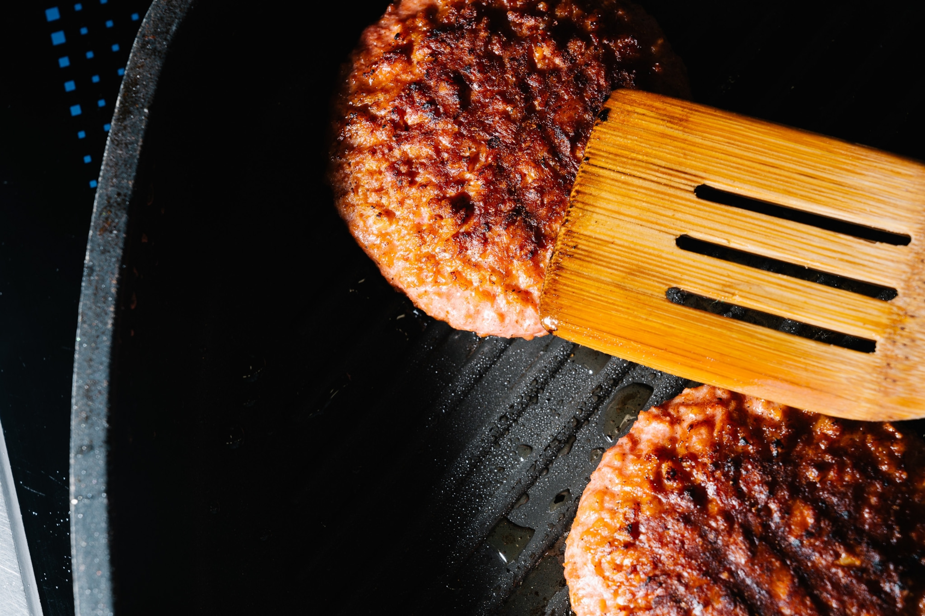 Burger in cast iron pan.