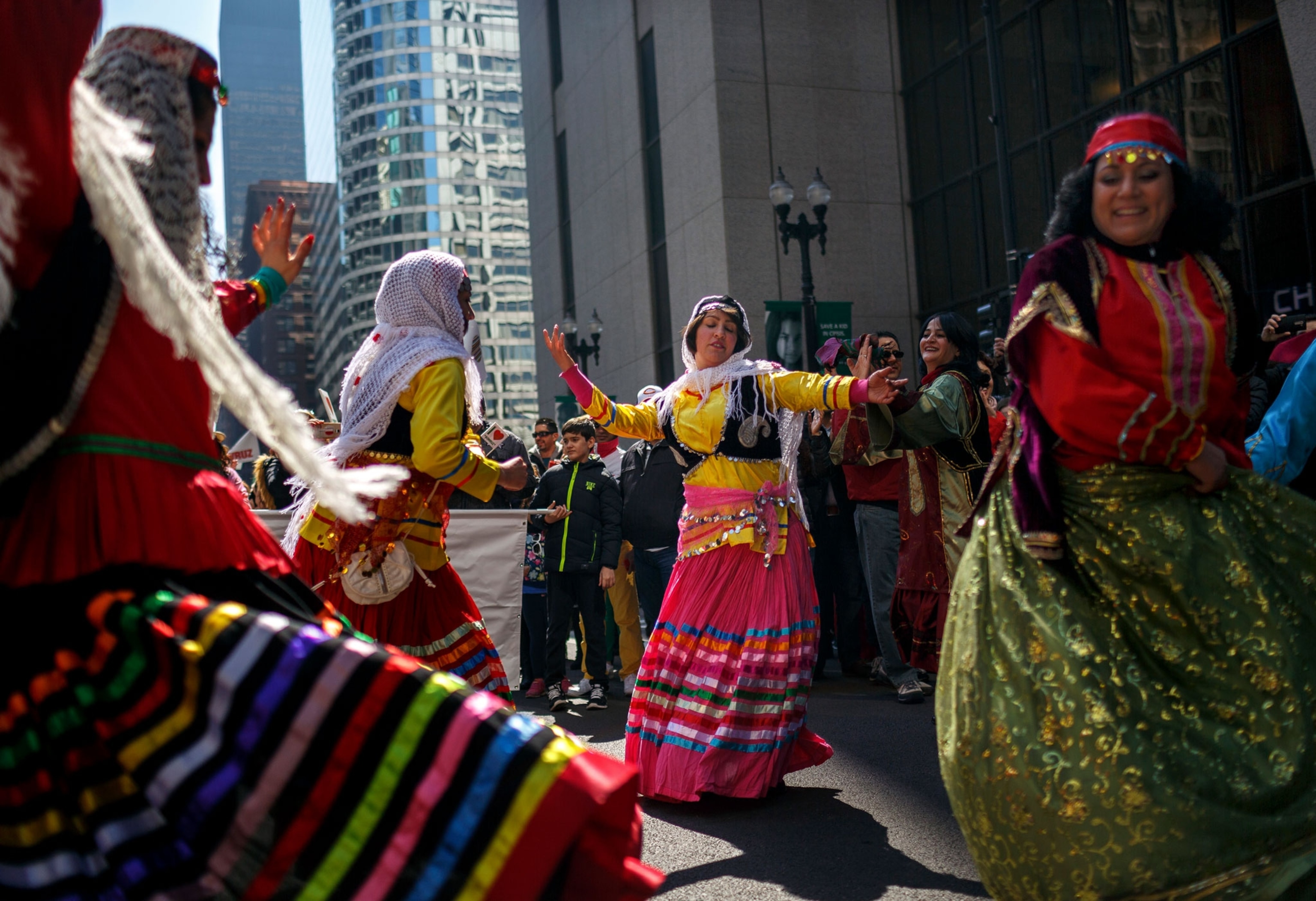 people dancing in traditional dresses in downtown Chicago