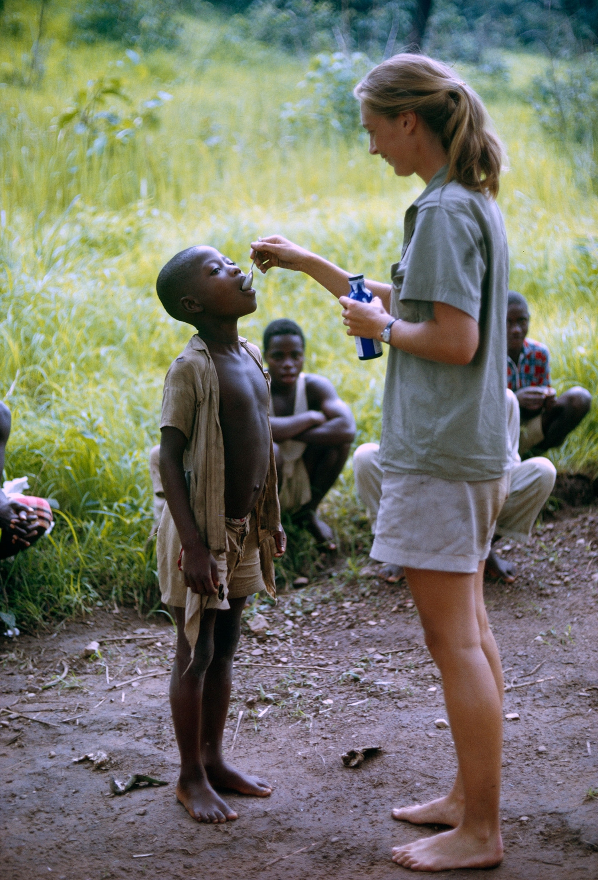 Jane Goodall spoon-feeding cough medicine