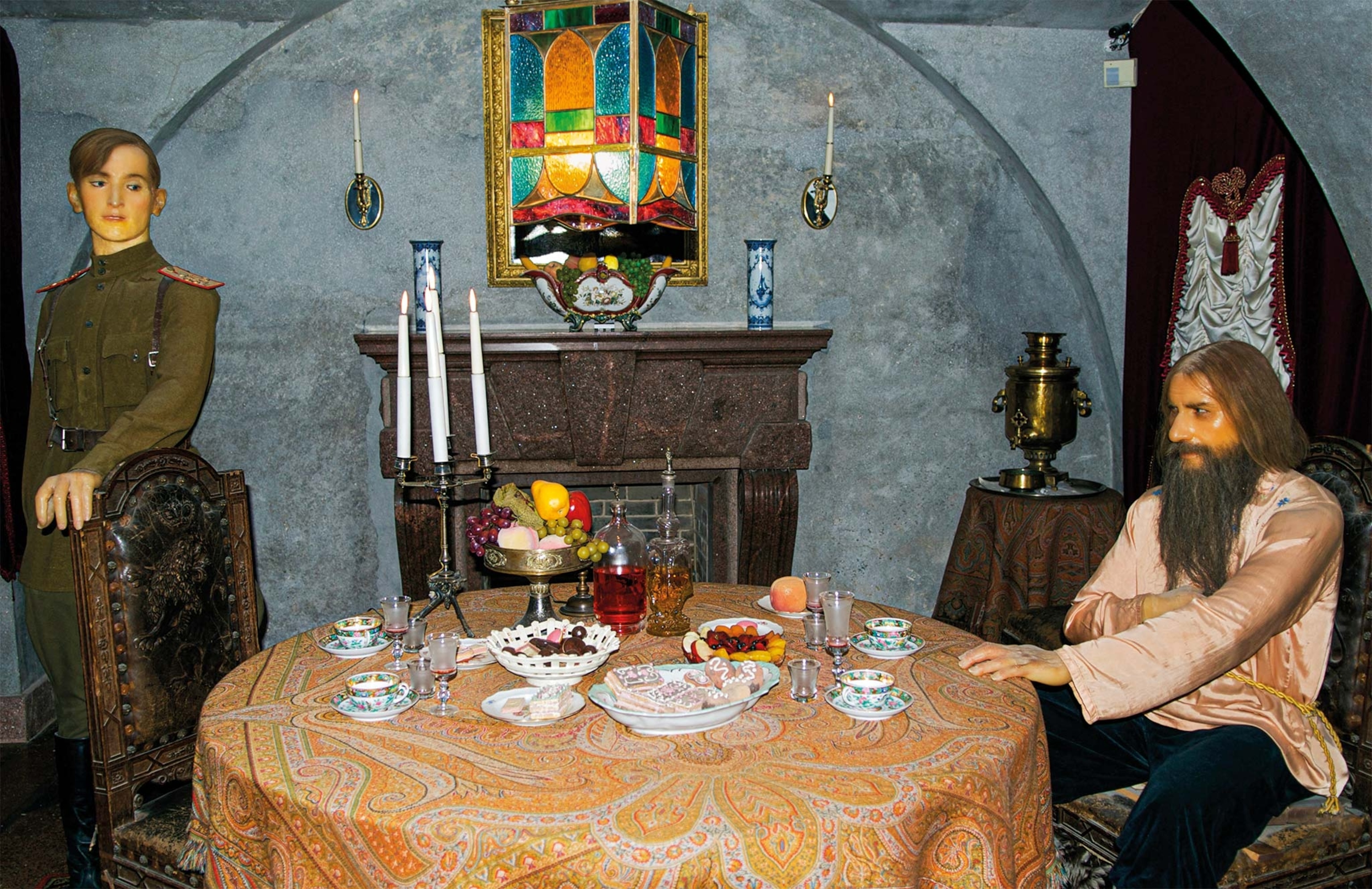 Waxwork figures of Yusupov (at left) and Rasputin in the basement room of the Yusupov Palace depict the murder plot.