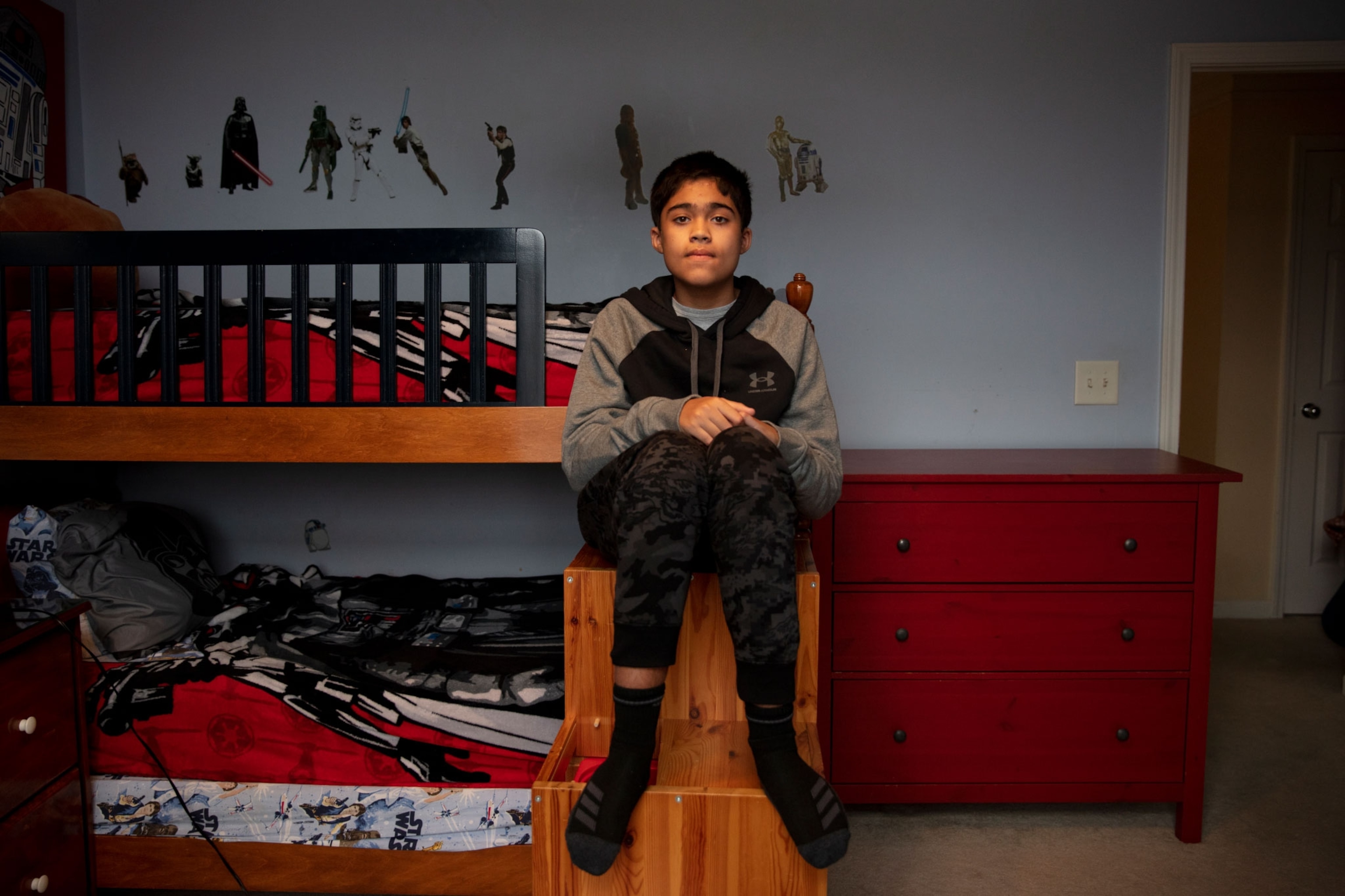 portrait of a boy in his bedroom