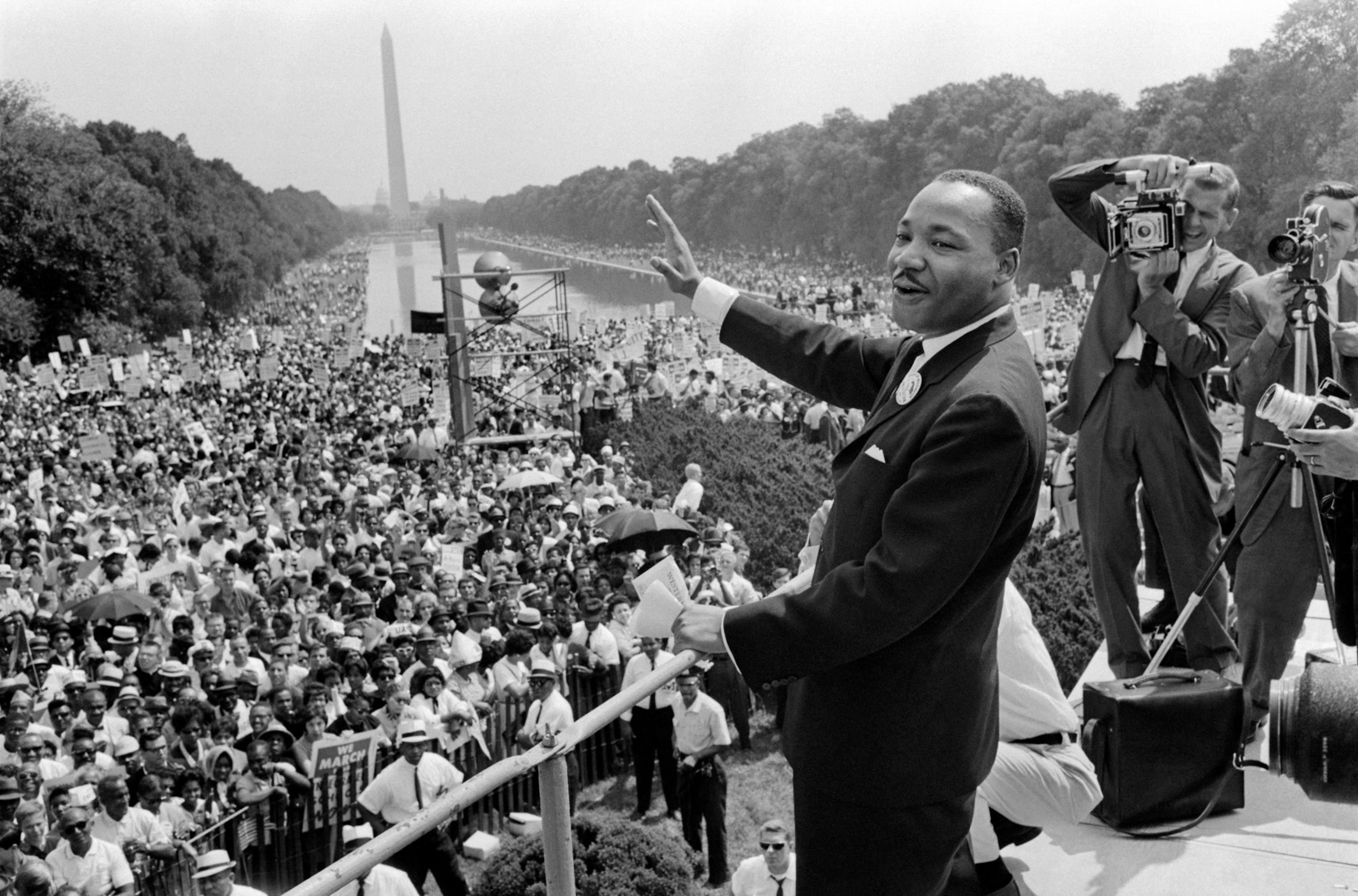 Martin Luther King waves to supporters on the Mall in Washington DC in August 1963.
