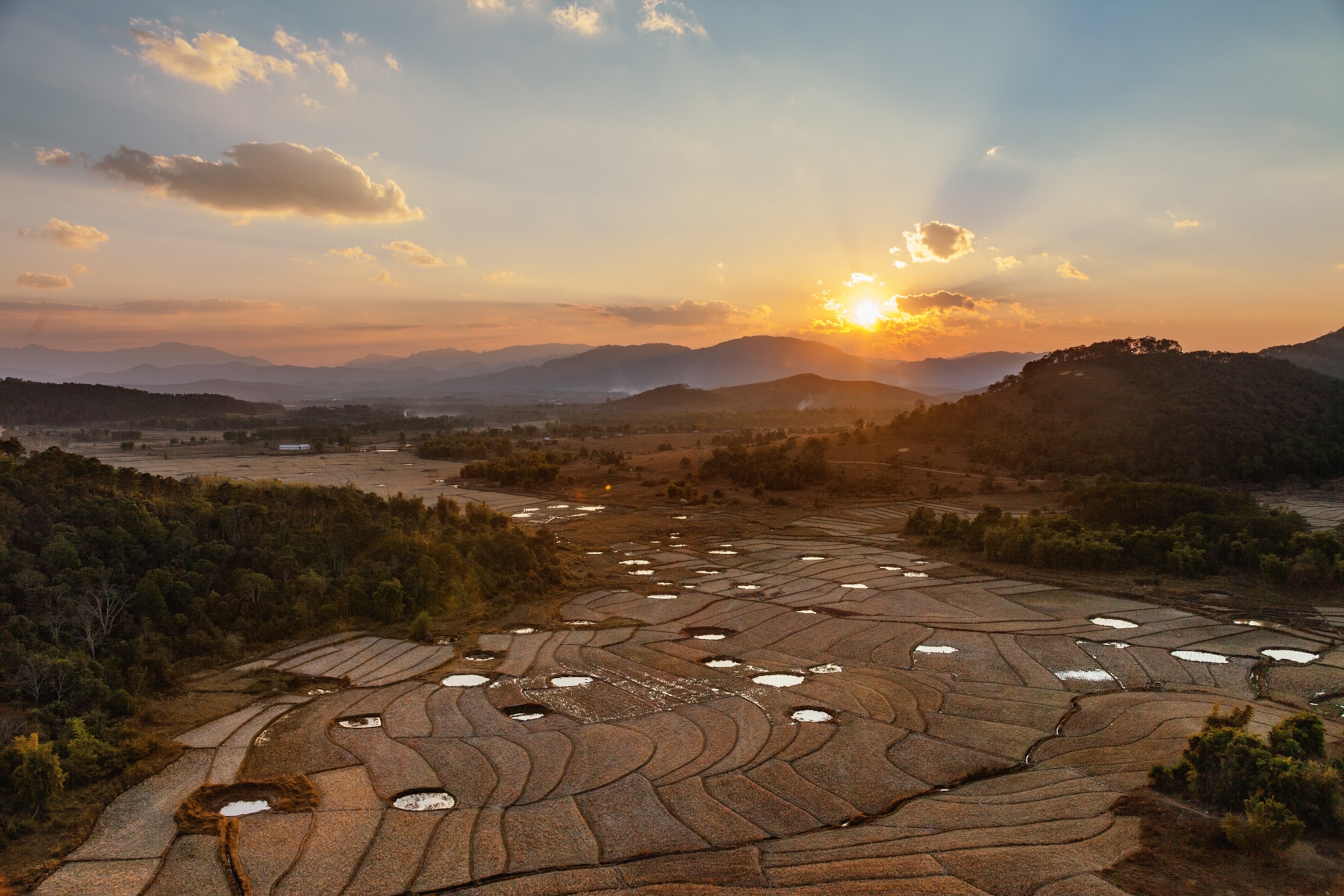 craters from U.S. air strikes used a fishponds or for irrigating crops in Laos