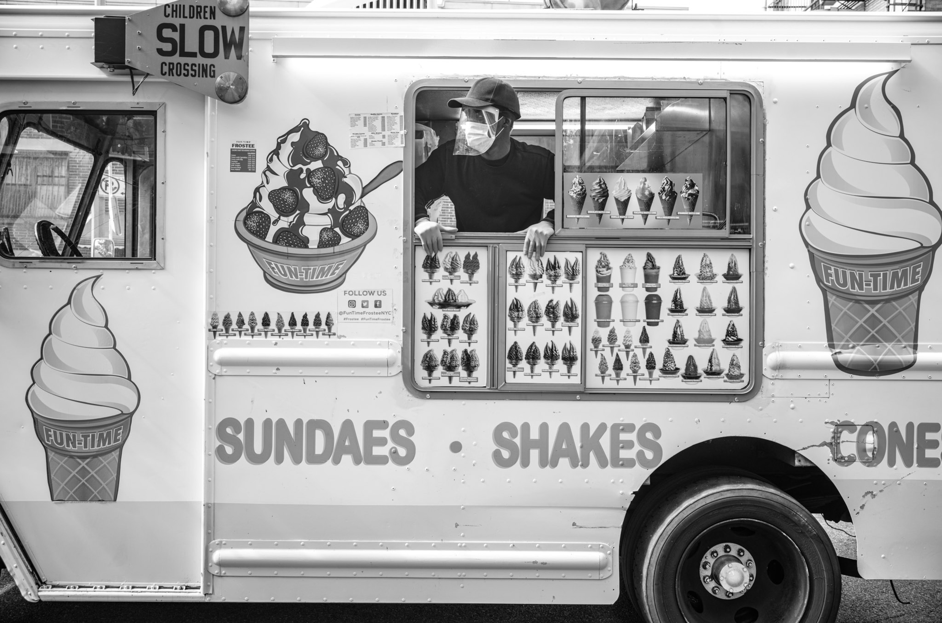 a person sticking their head out of an ice cream truck window