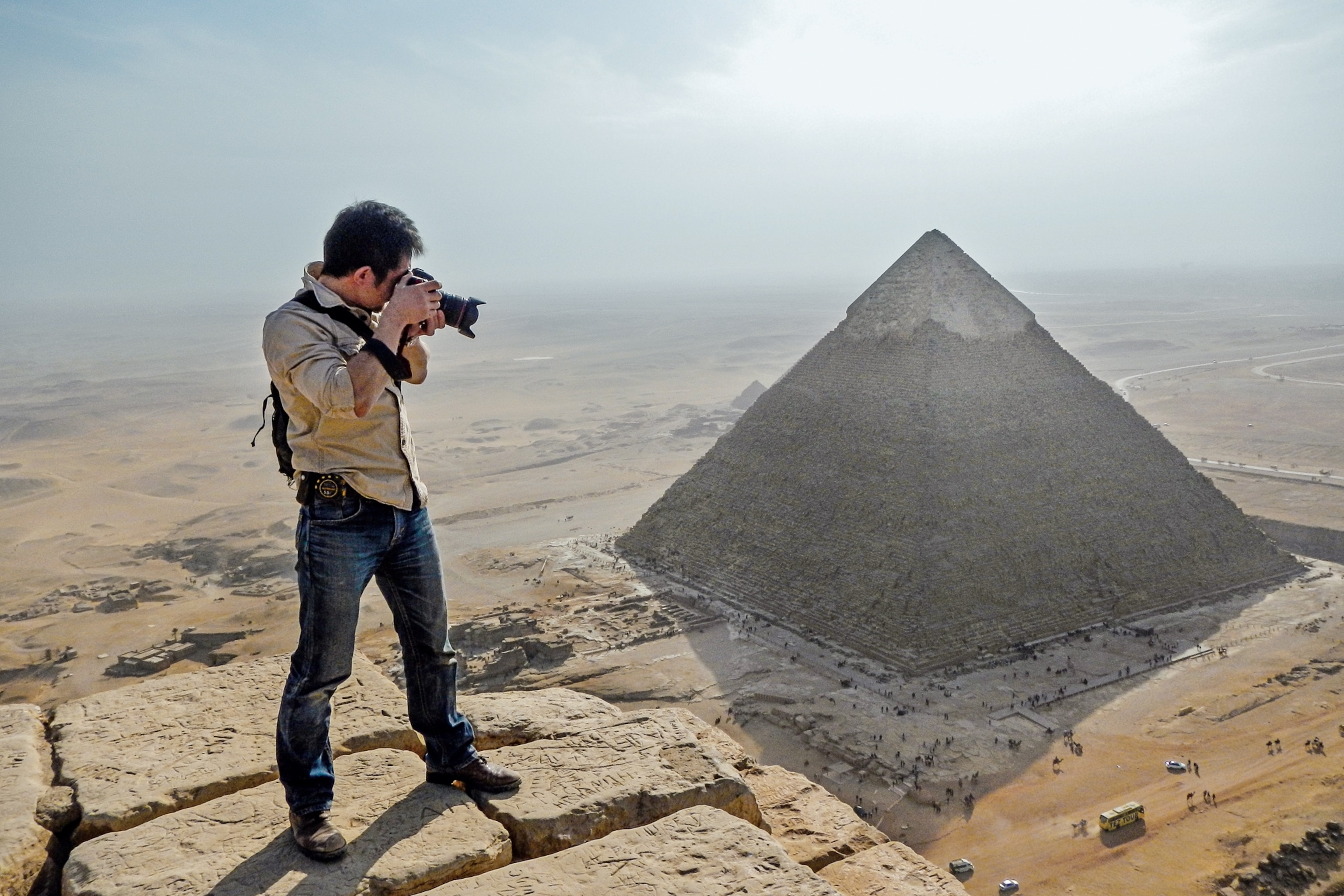 Yukinori Kawae standing on top of a pyramid for the best view