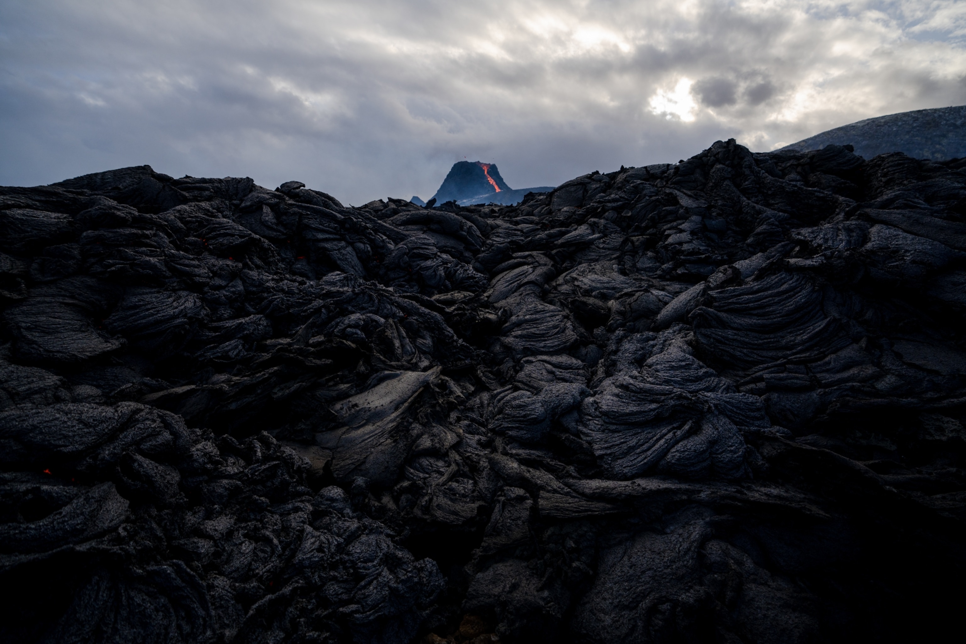 eshly cooled rock along the base of the lava flow in Iceland