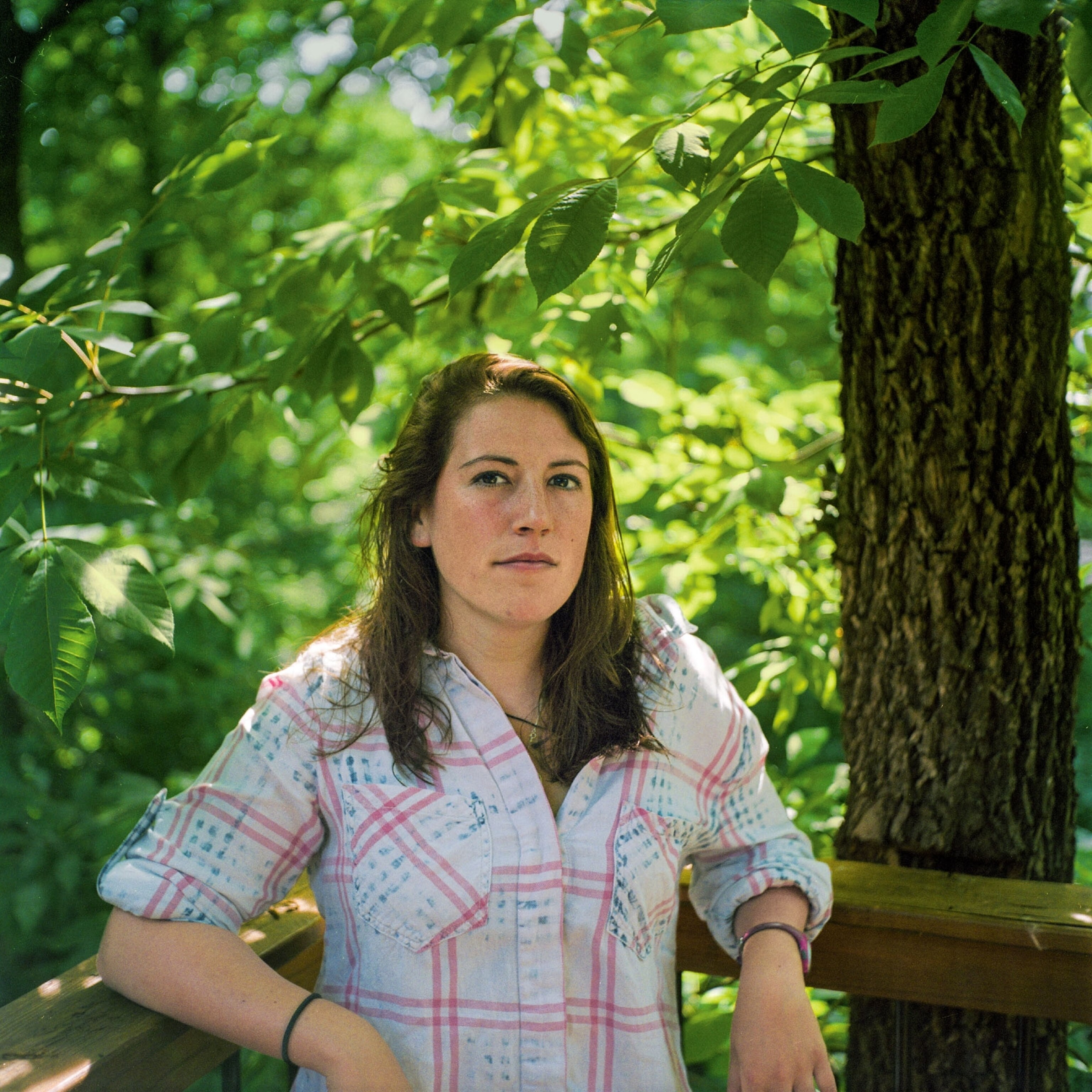 young woman posing for a portrait in nature