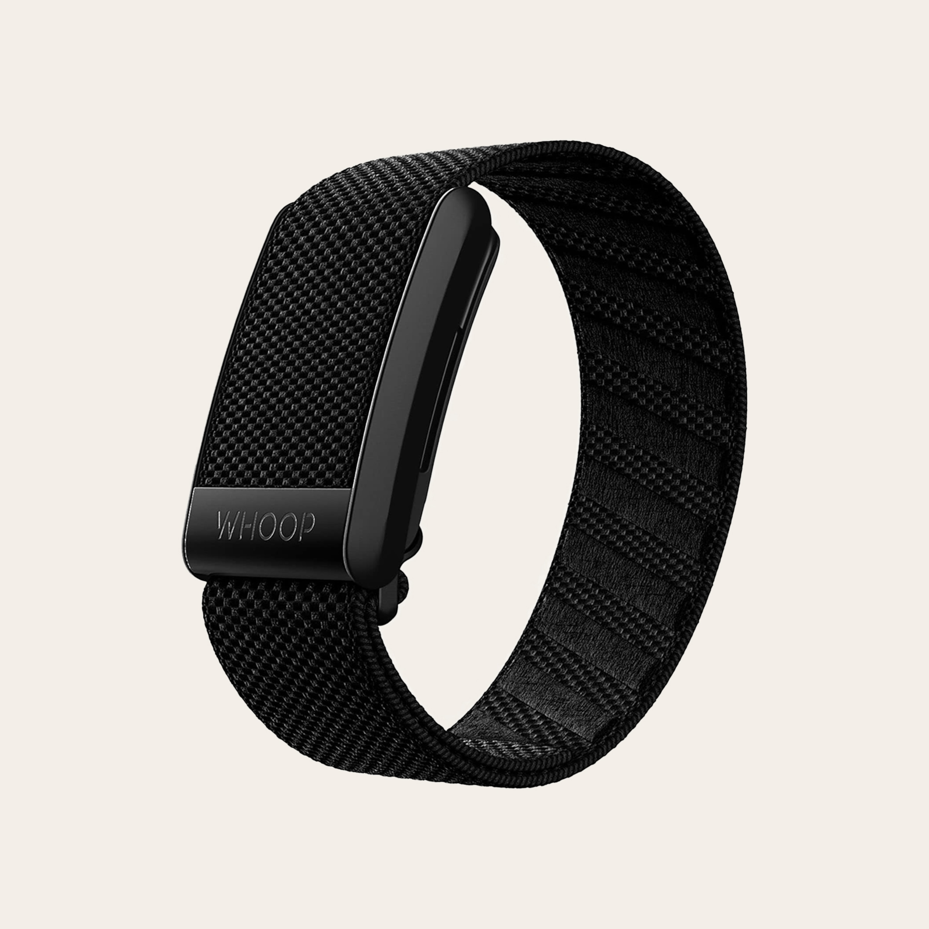 A black rectangular fitness tracker without a display, with a fabric band against a tan background.