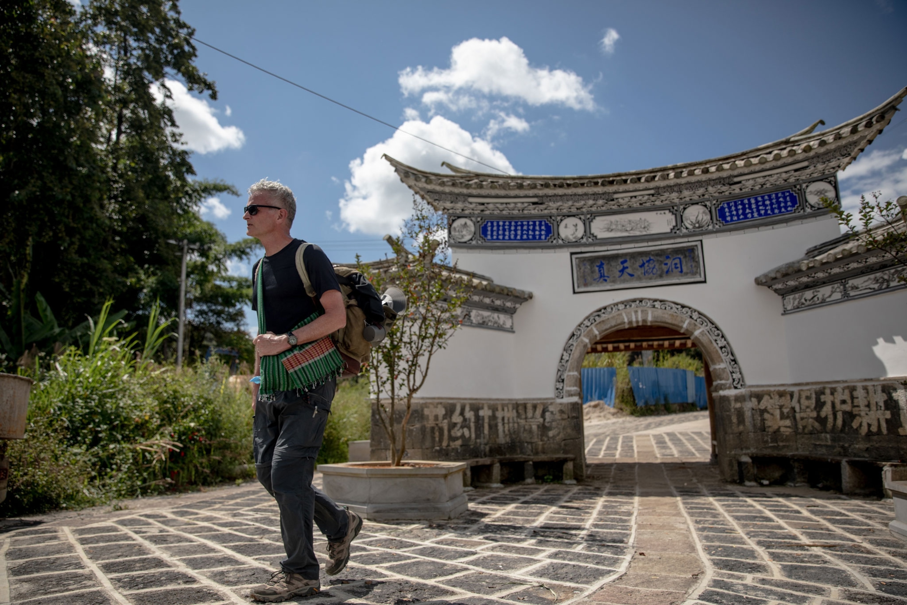 Paul Salopek walks through arch
