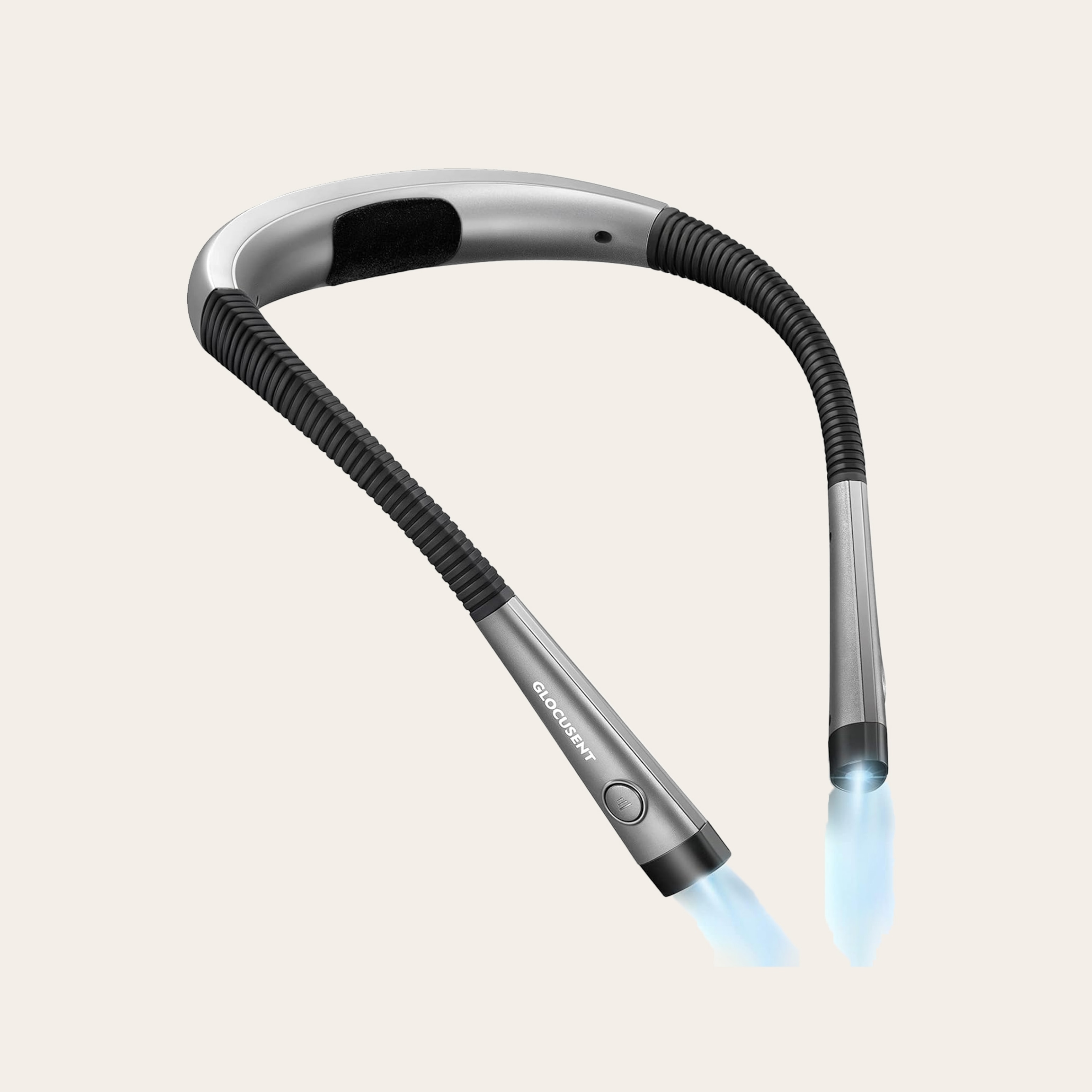 A tubular object that is grey and black emits light from its ends.