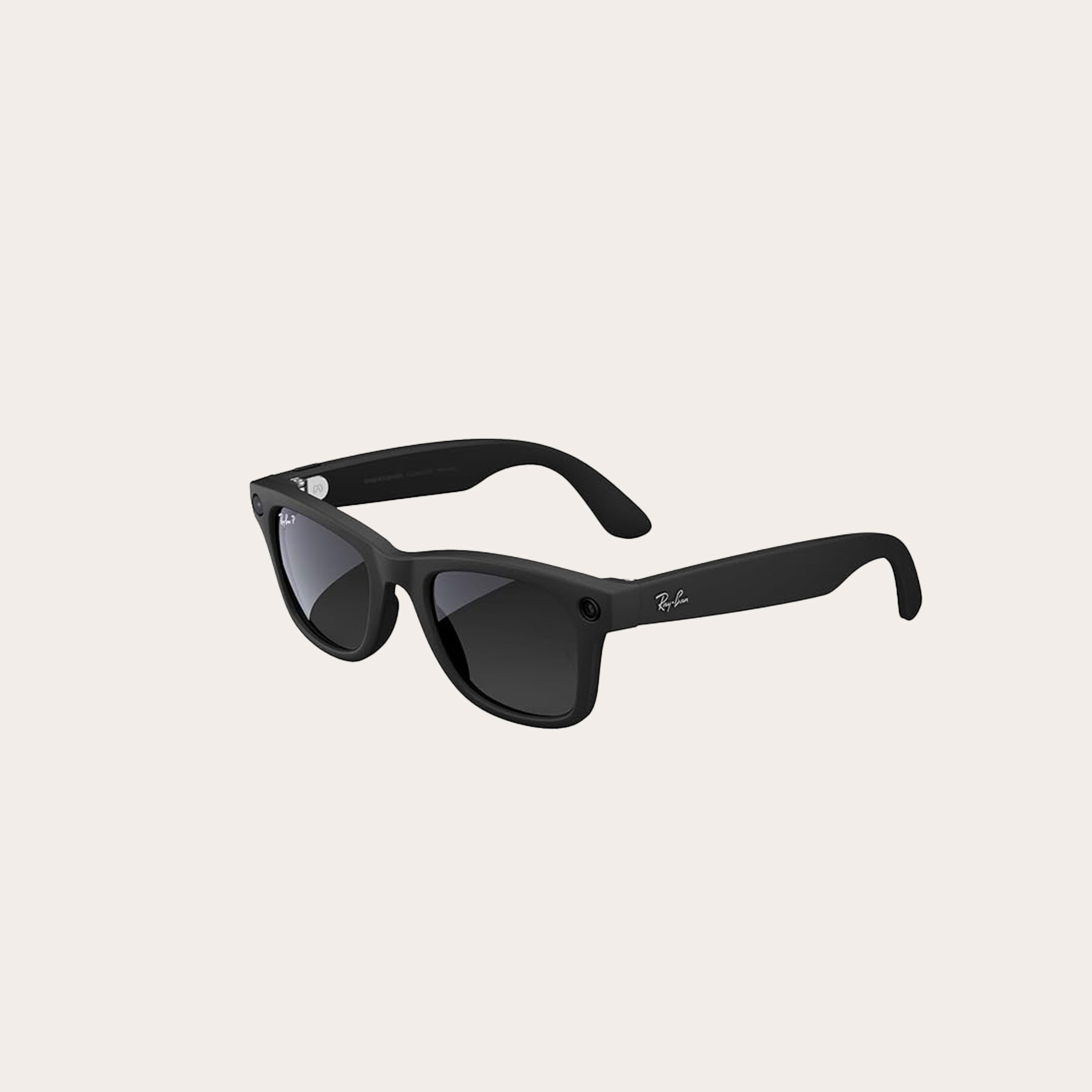 Black sunglasses places on a tan background
