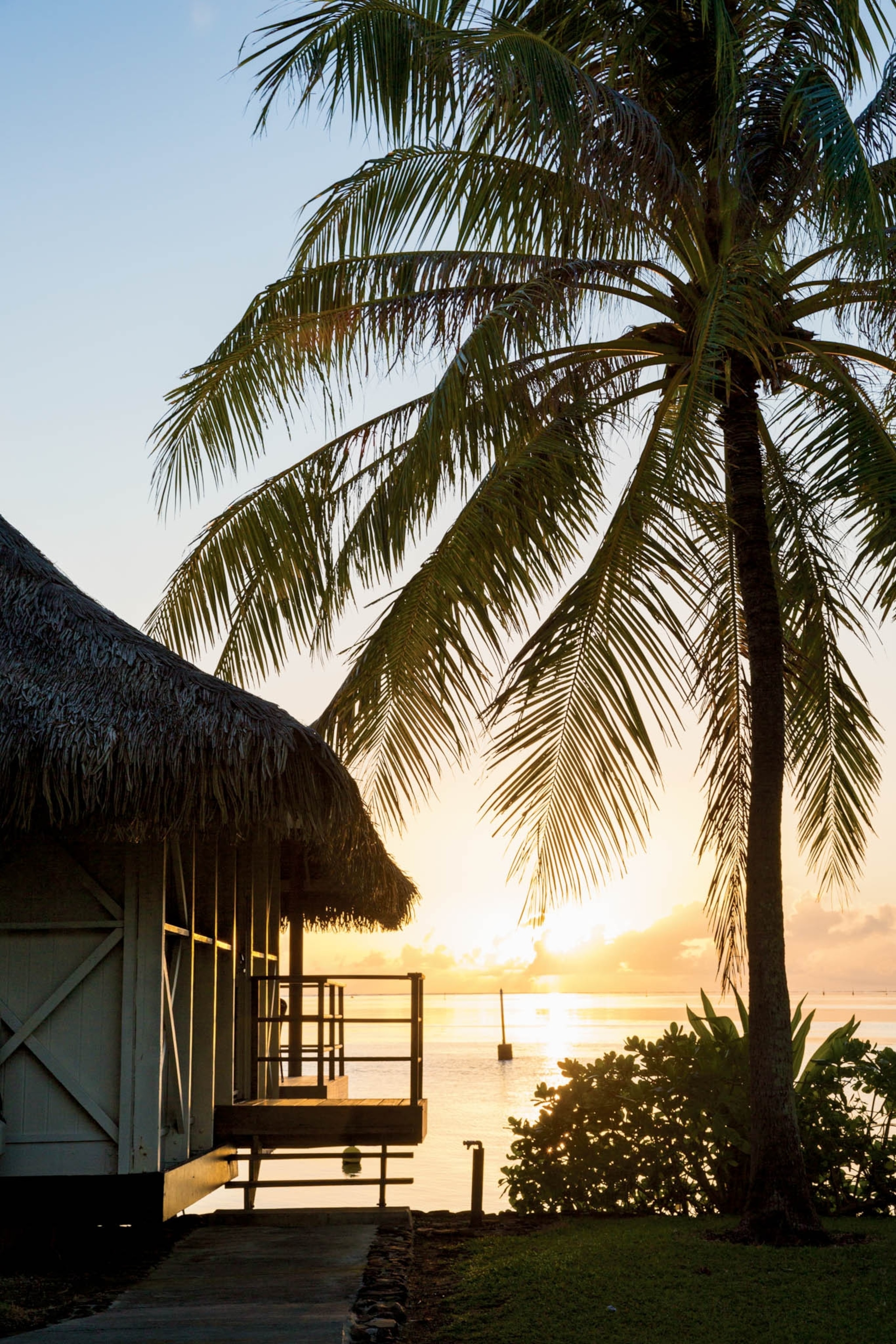 seaside bungalows at sunset