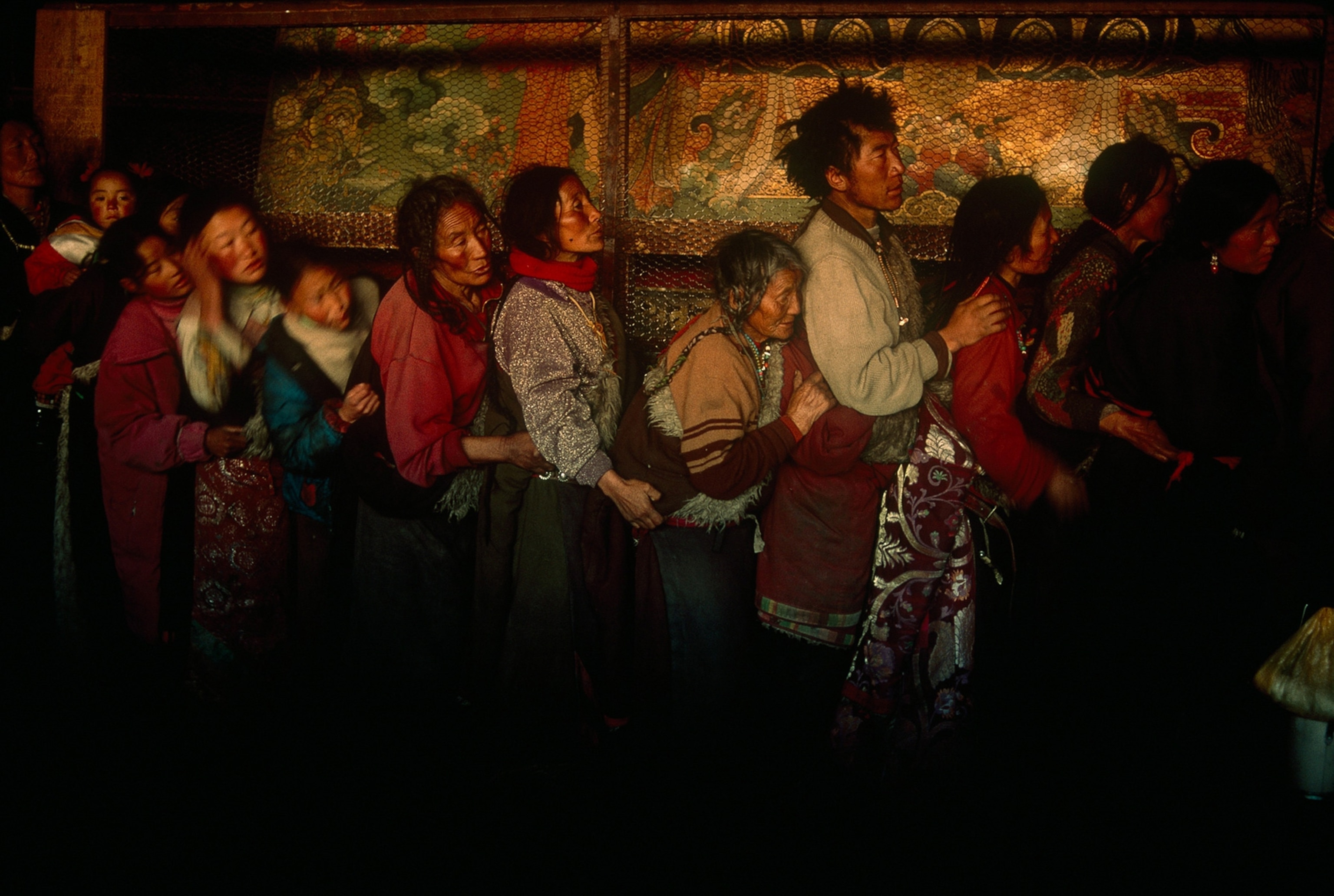 pilgrims standing in line to enter the heart of the Jokhang Temple in Lhasa