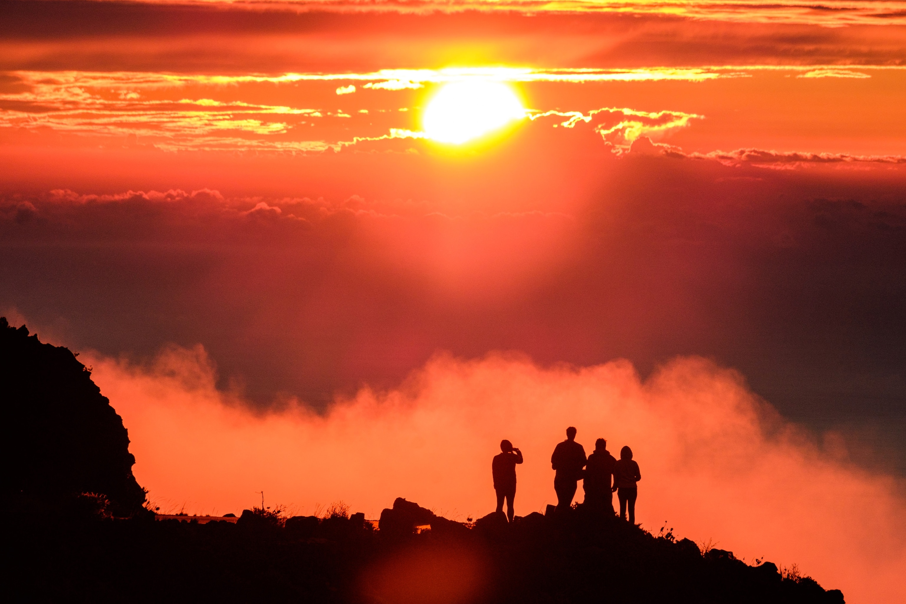 people watching a sunset in Haleakala National Park, Hawaii