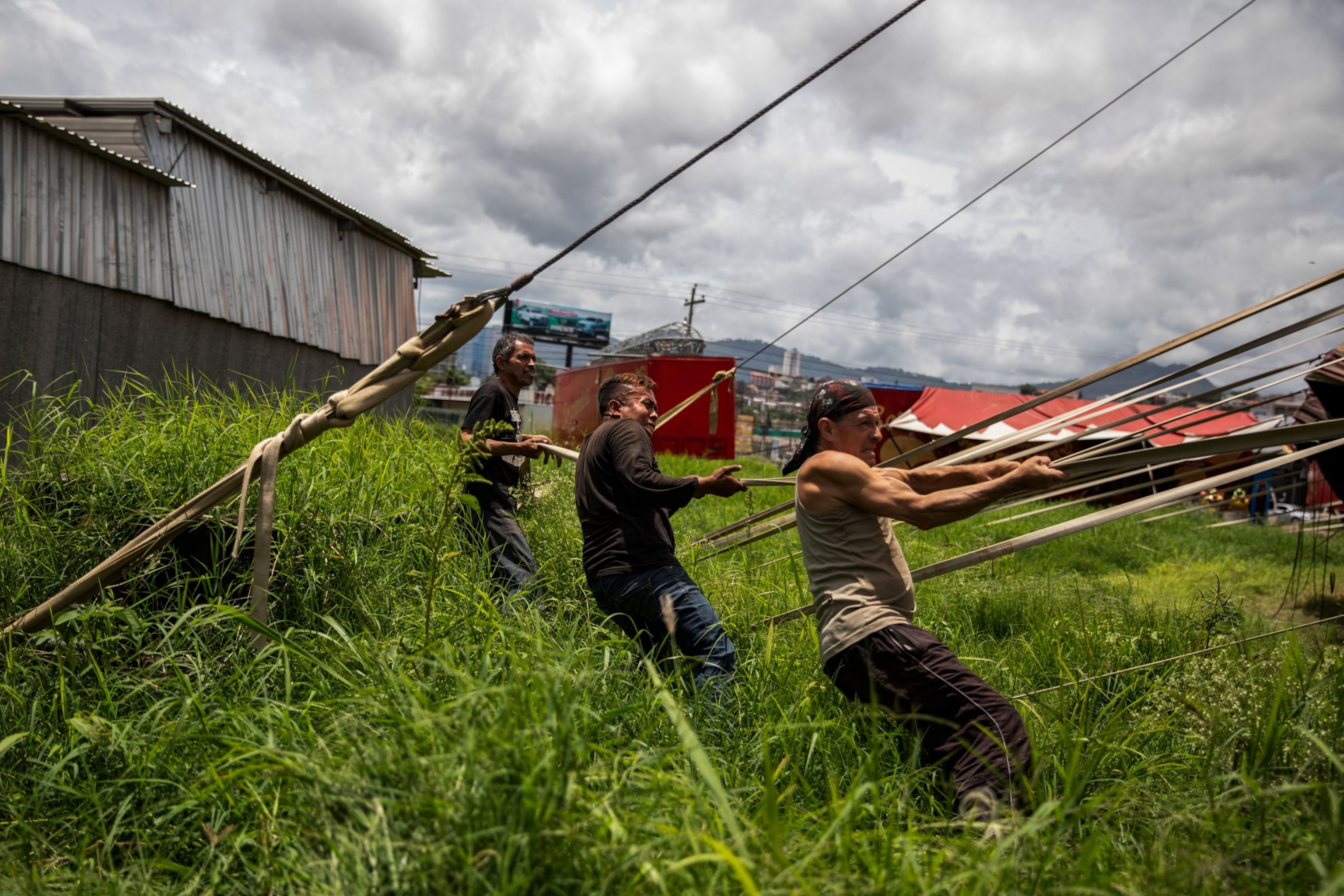 people taking down a circus tent in Honduras