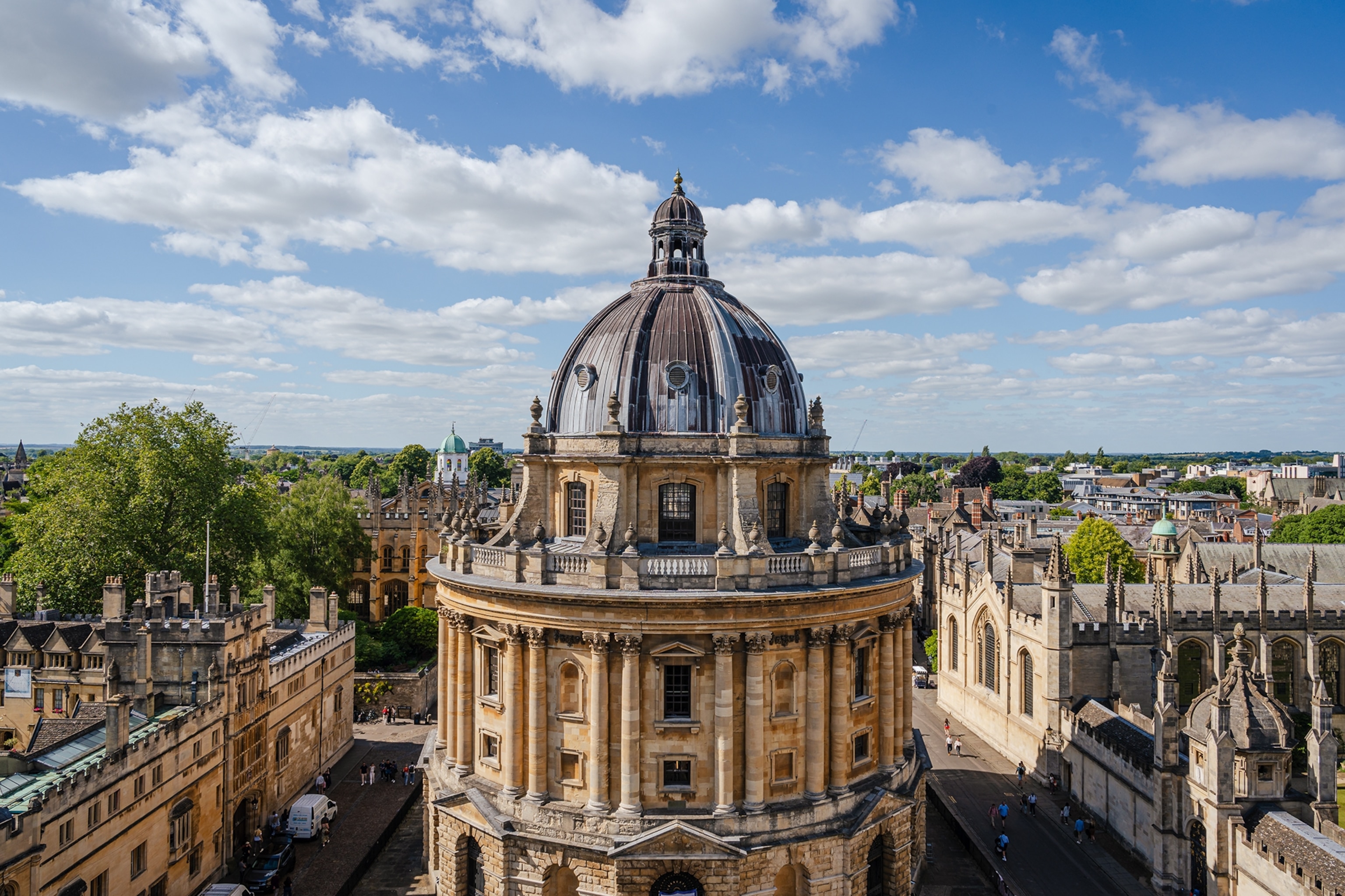 Close up of a domed sandstone building in a city