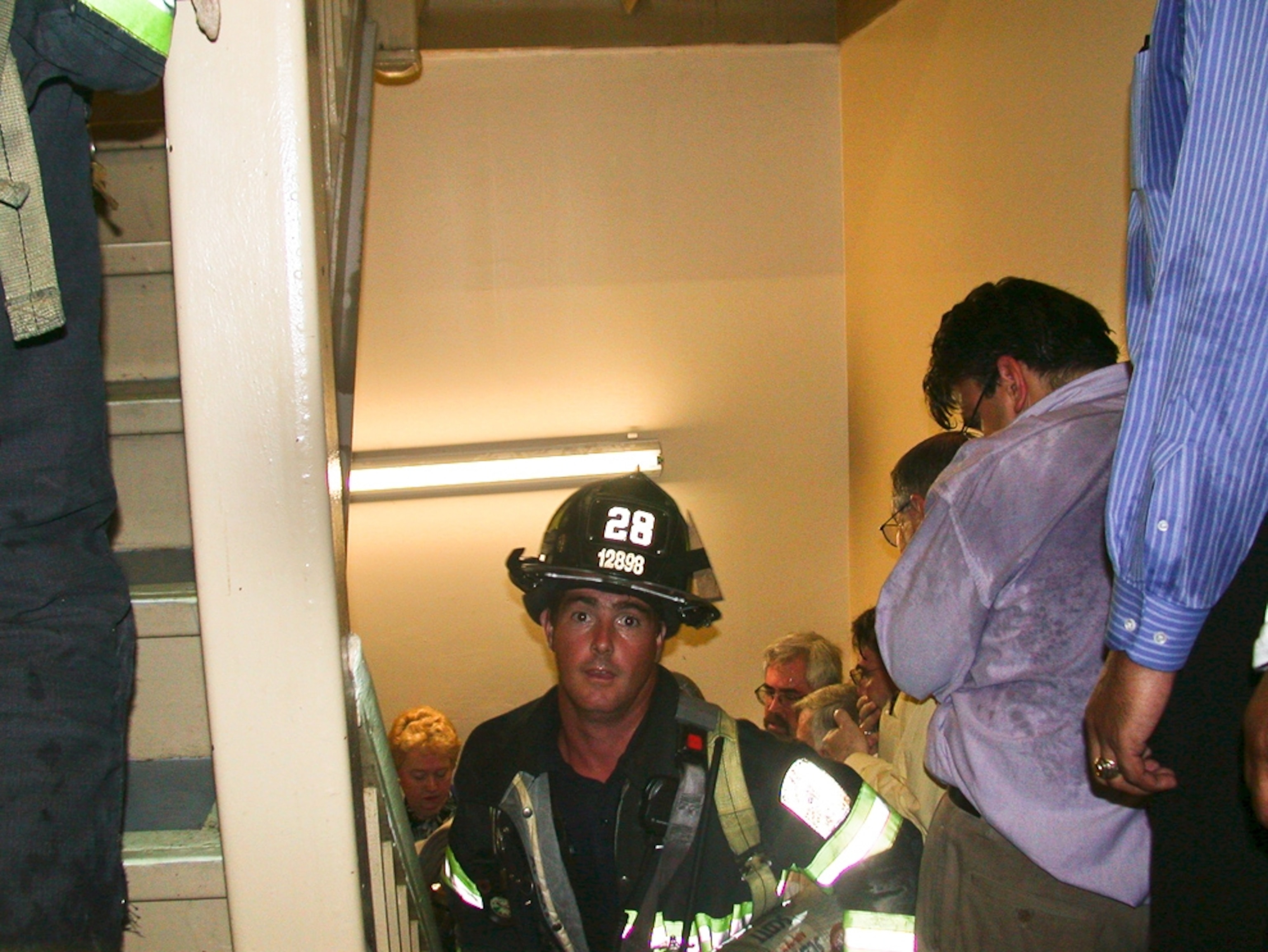 9/11 picture: firefighter Mike Kehoe walking up a stairwell in the World Trade Center north tower
