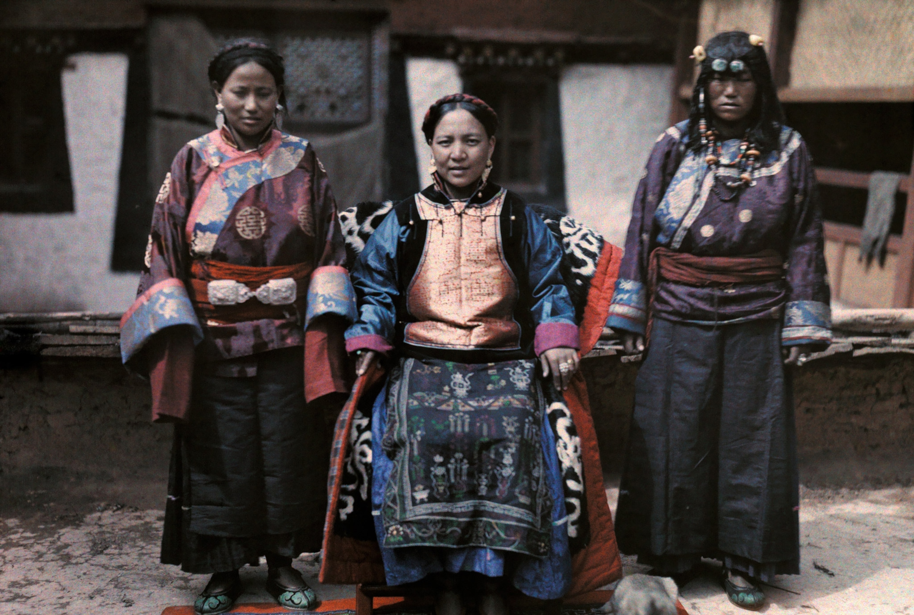 Photo of three women in traditional dress posing.