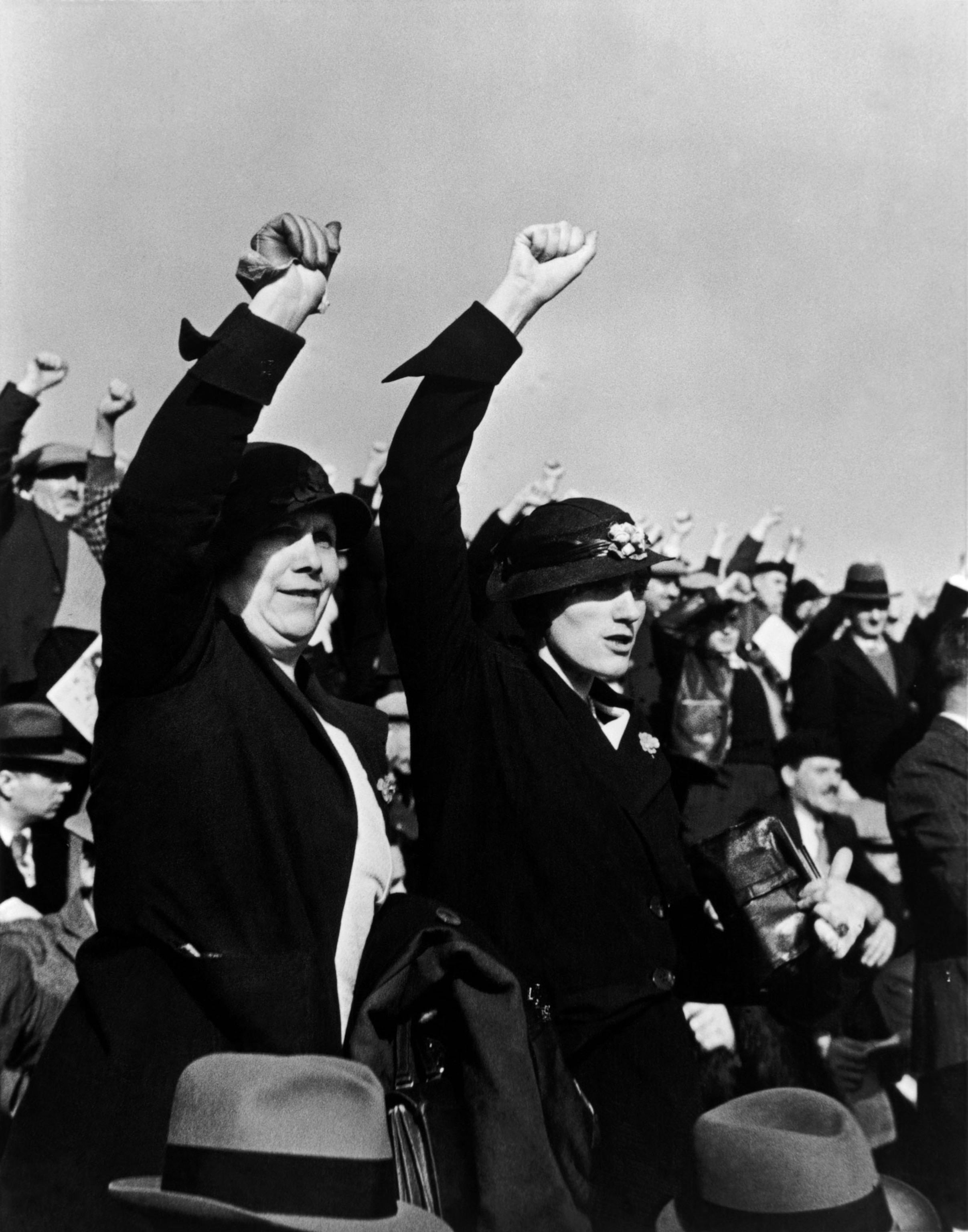 two French women raising their fists