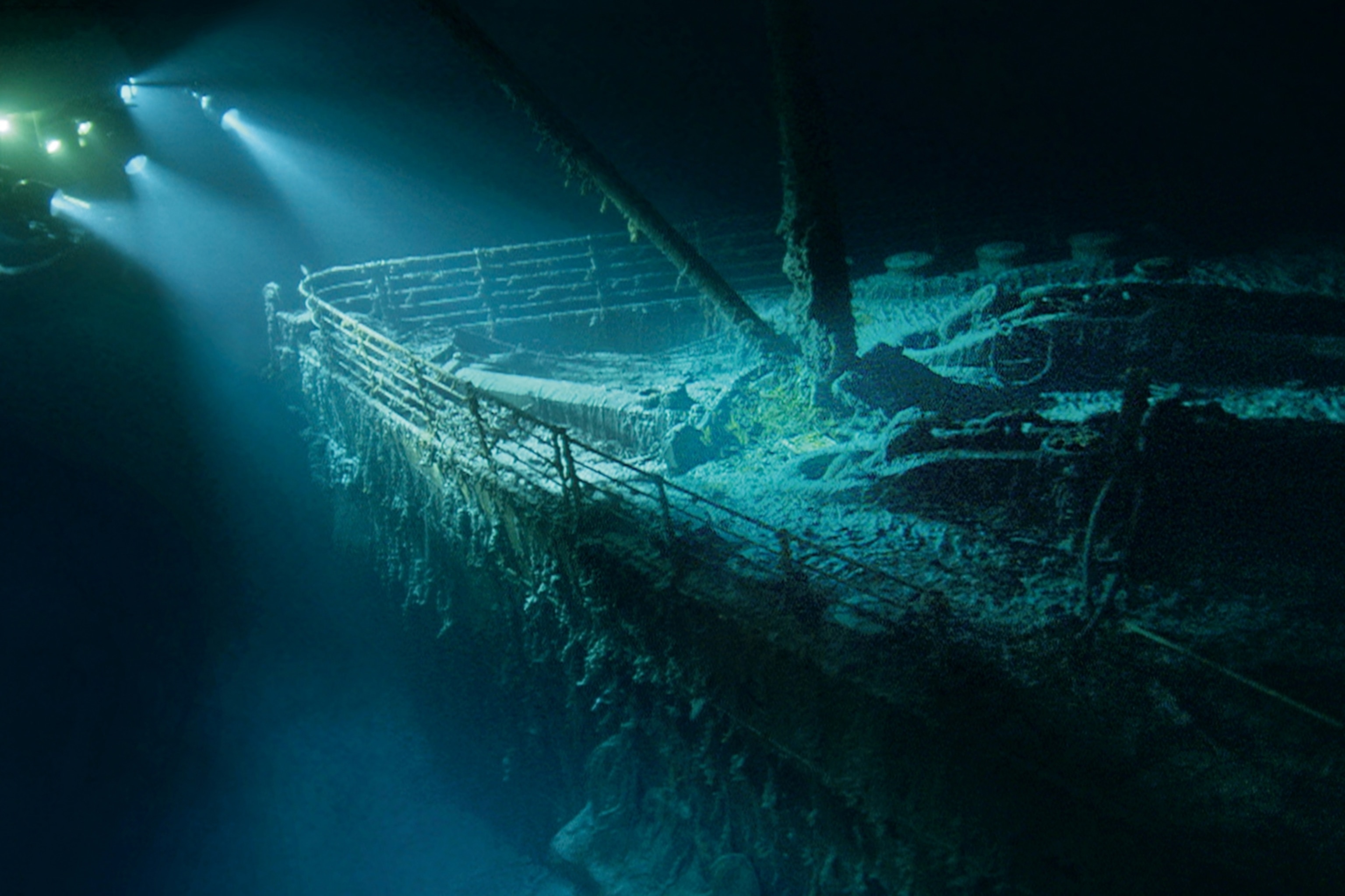 the ghostly bow of the Titanic emerging from the darkness during a dive
