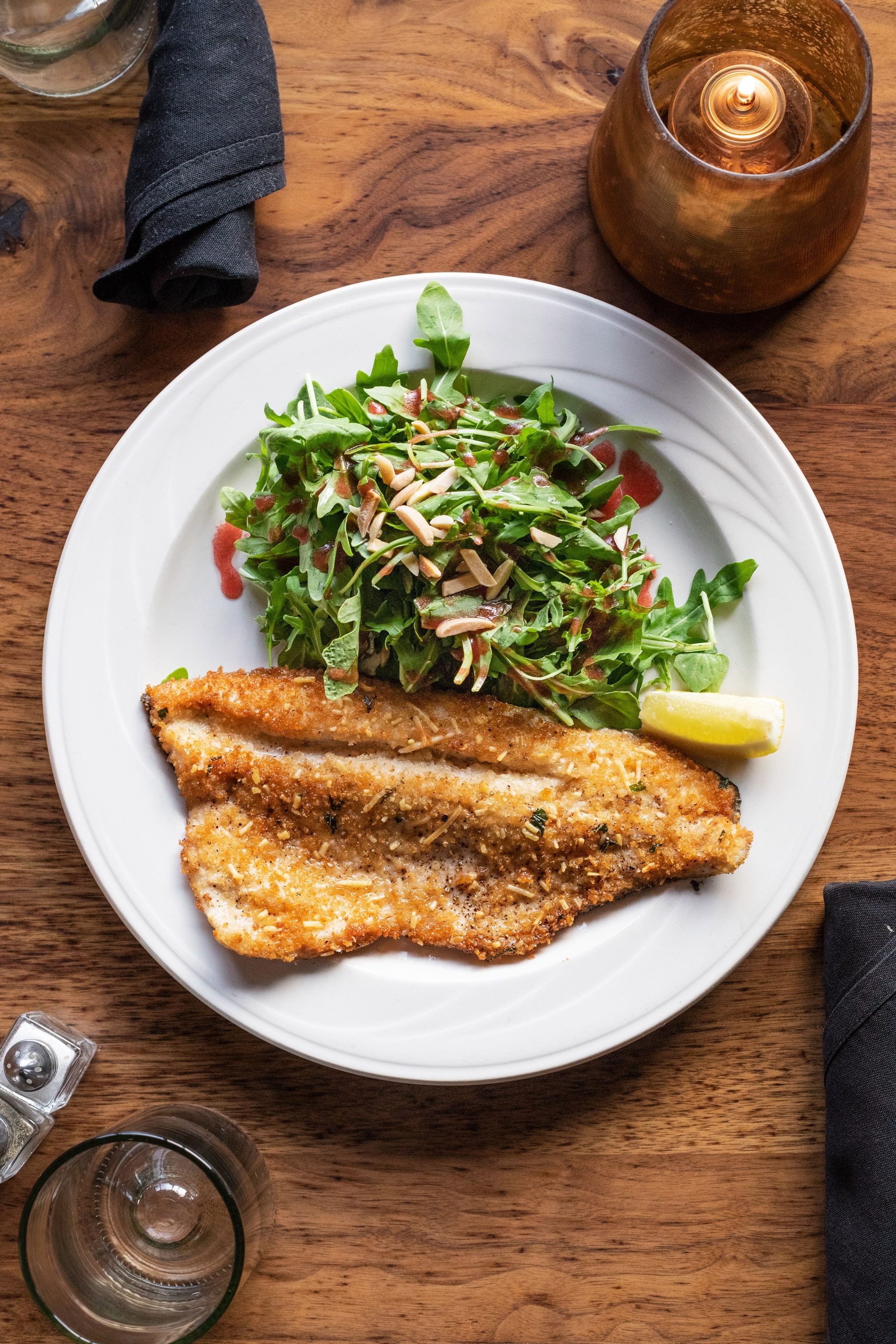 a trout dish with a fresh arugula salad at Enoteca in Ketchum, Idaho