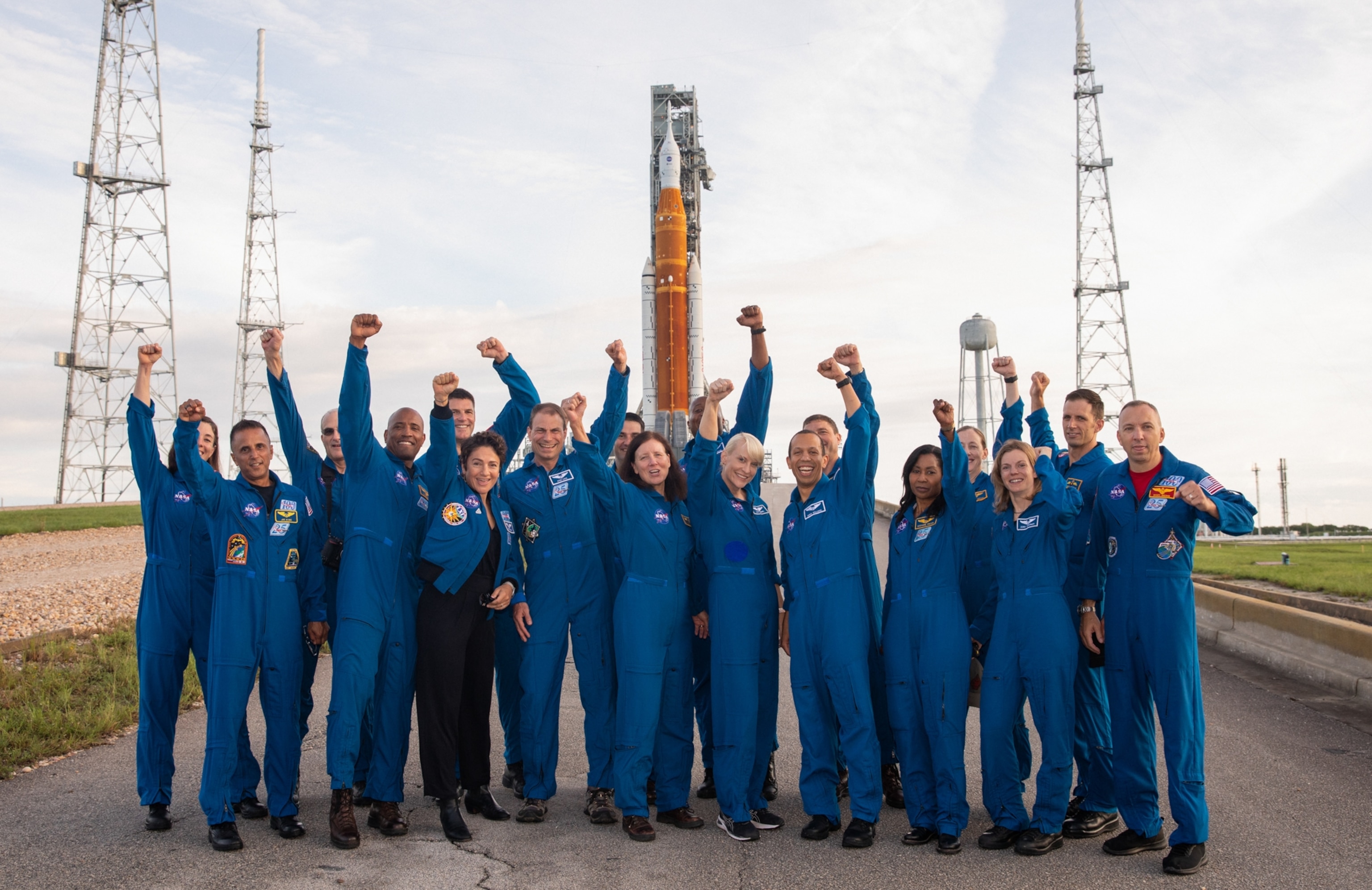 Astronauts and astronaut candidates from NASA and the Canadian Space Agency pose for a photograph in front of NASA’s Artemis I Space Launch System and Orion spacecraft atop the mobile launcher on the pad at Launch Complex 39B