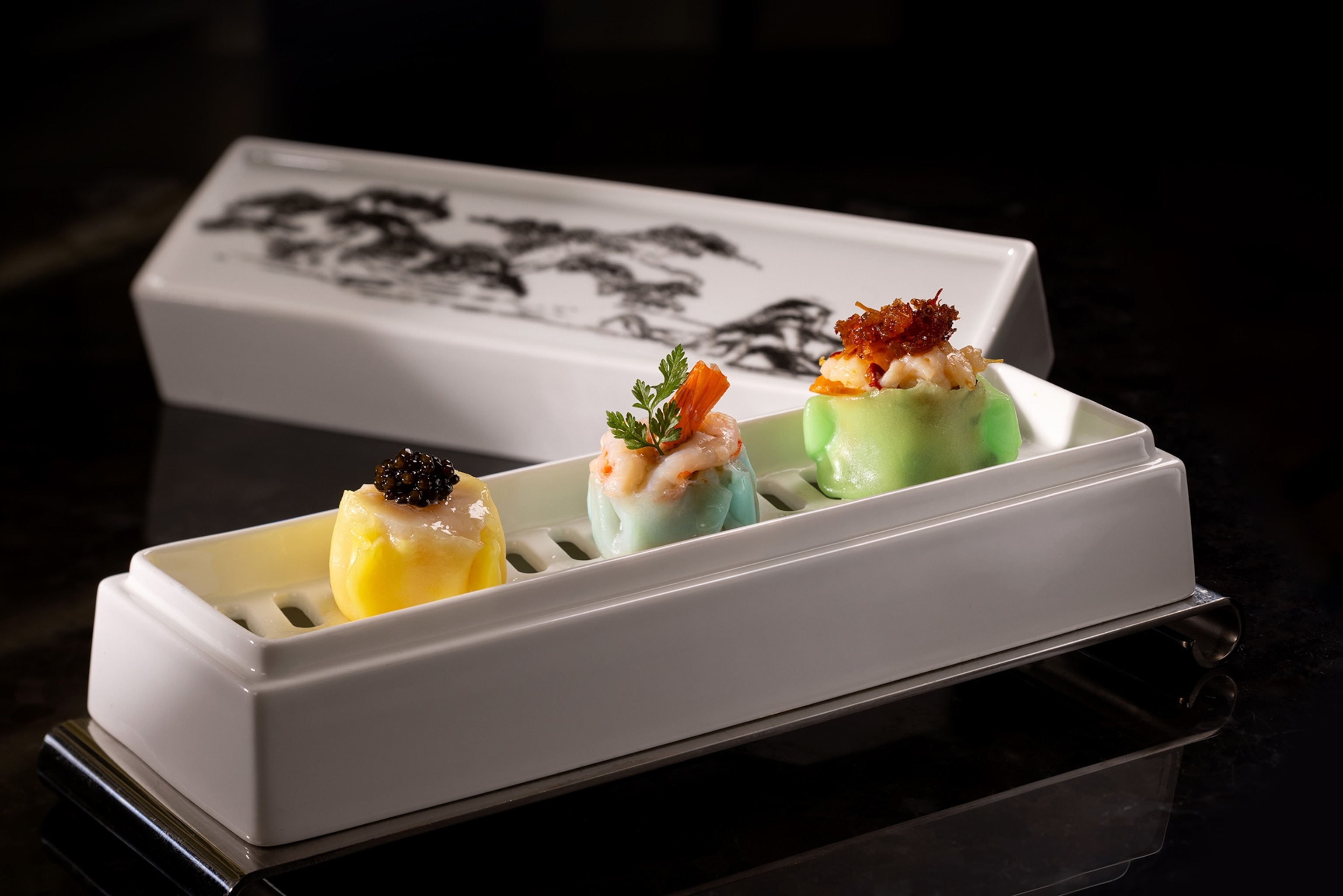 A decorated ceramic box holds Superior Dumplings at Lai Ching Heen.