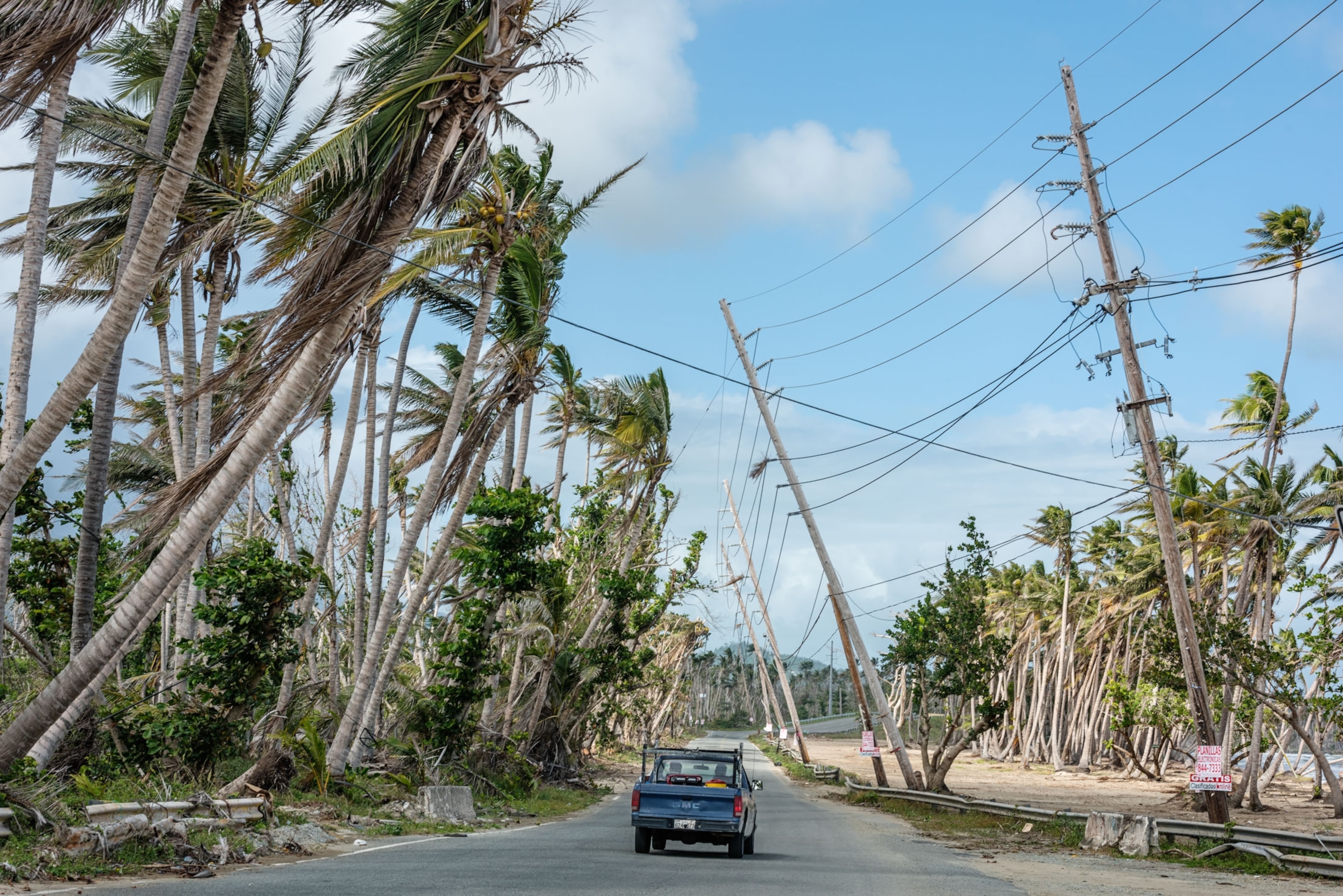 power lines leaning over the route leading north from Punta Santiago