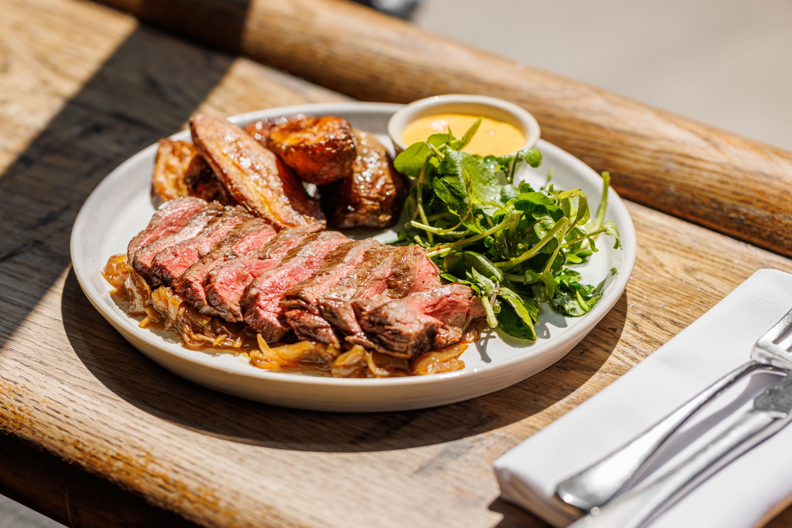 pork belly, potatoes and greens served