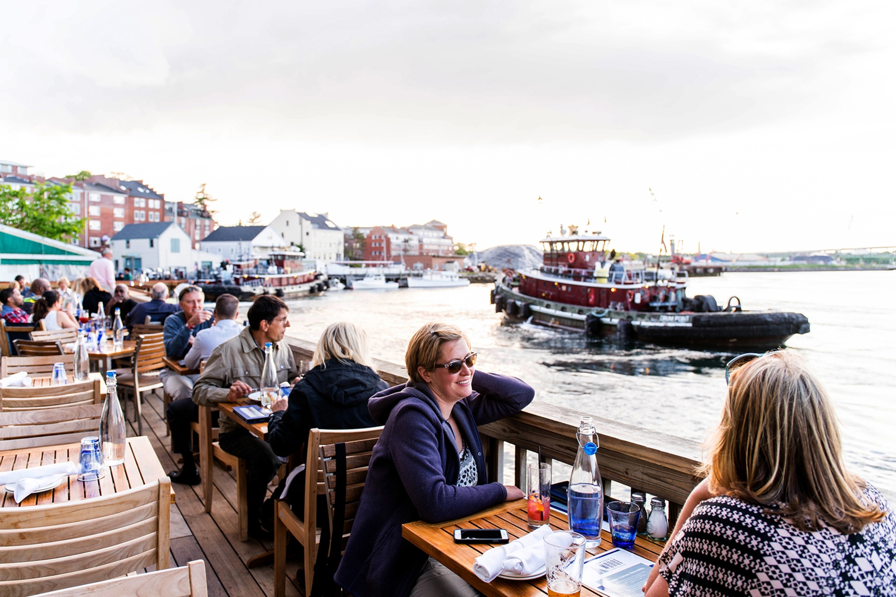 the Martingale Wharf and tugboats coming to dock in Portsmouth, New Hampshire