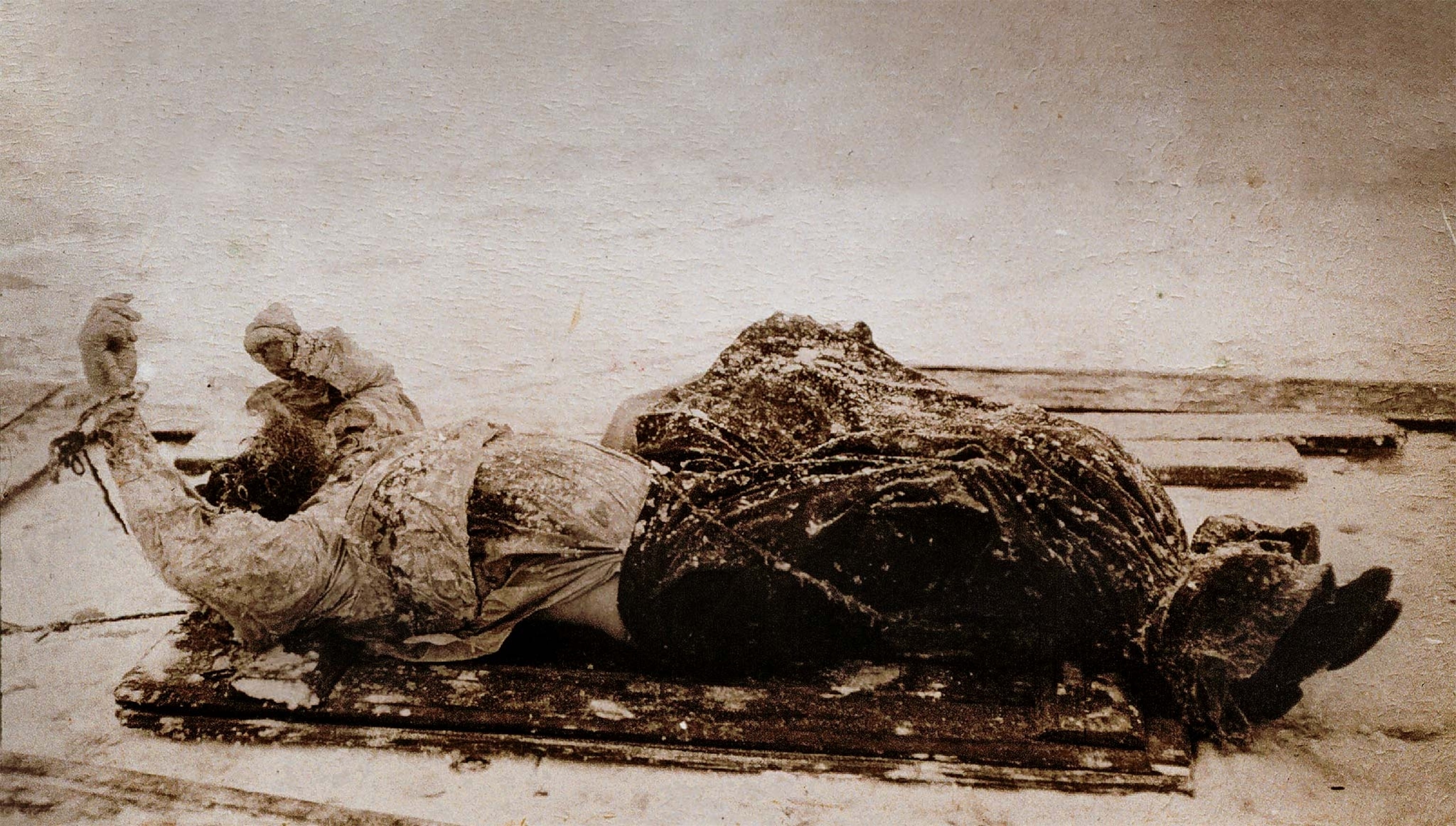 A photo of Rasputin’s battered body after it was pulled from the river a few days after his murder